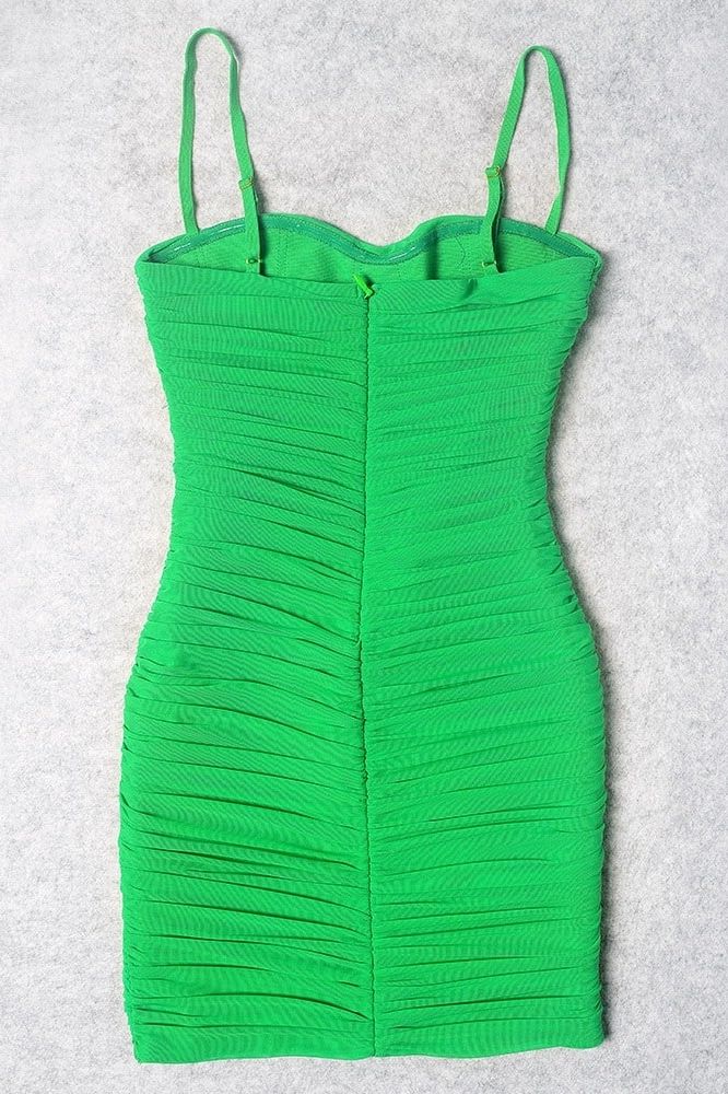 Woman wearing a figure flattering  Cassie Bodycon Wrap Mini Dress - Emerald Green BODYCON COLLECTION