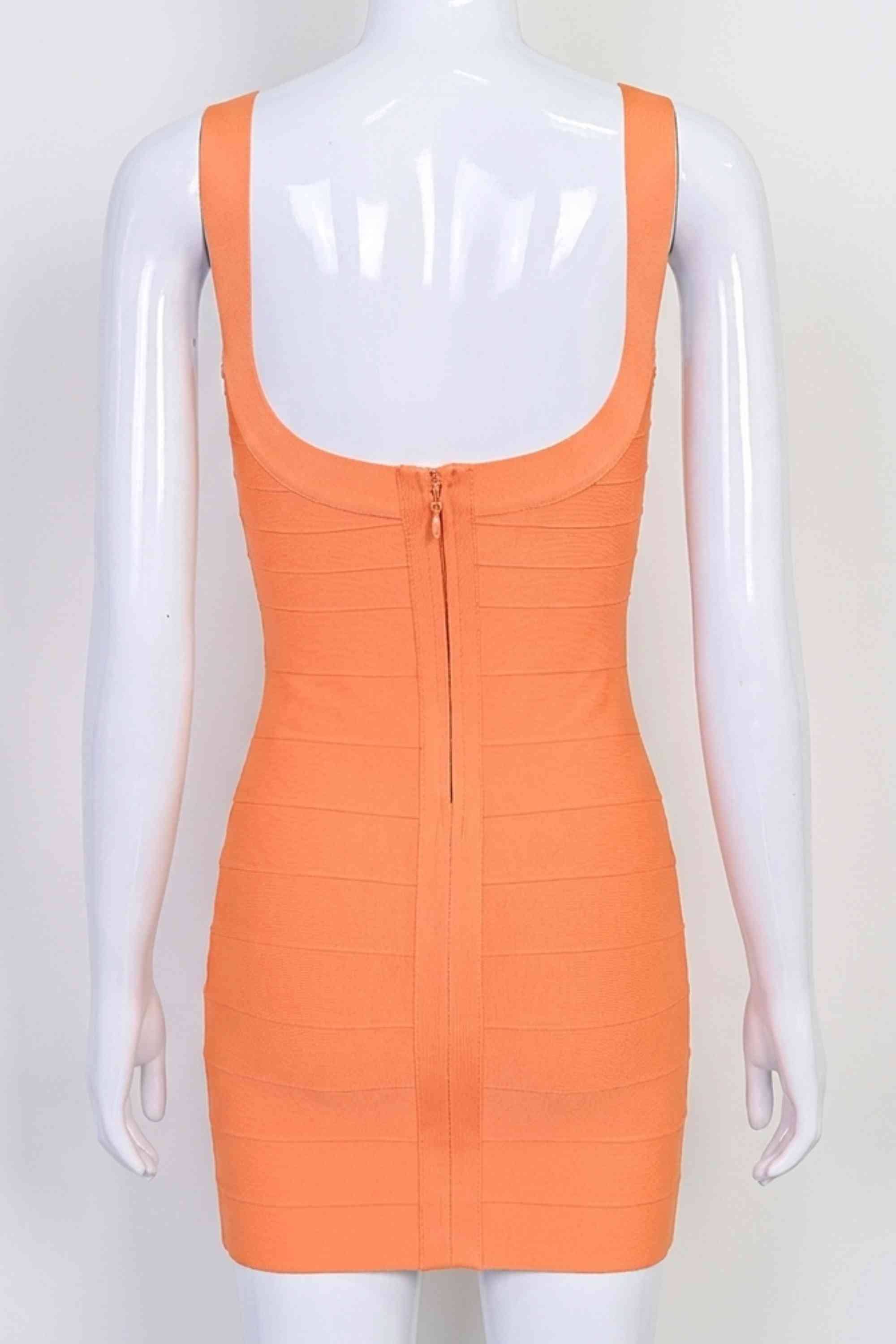 Woman wearing a figure flattering  Cindy Bandage Mini Dress - Apricot Orange BODYCON COLLECTION Pty Ltd