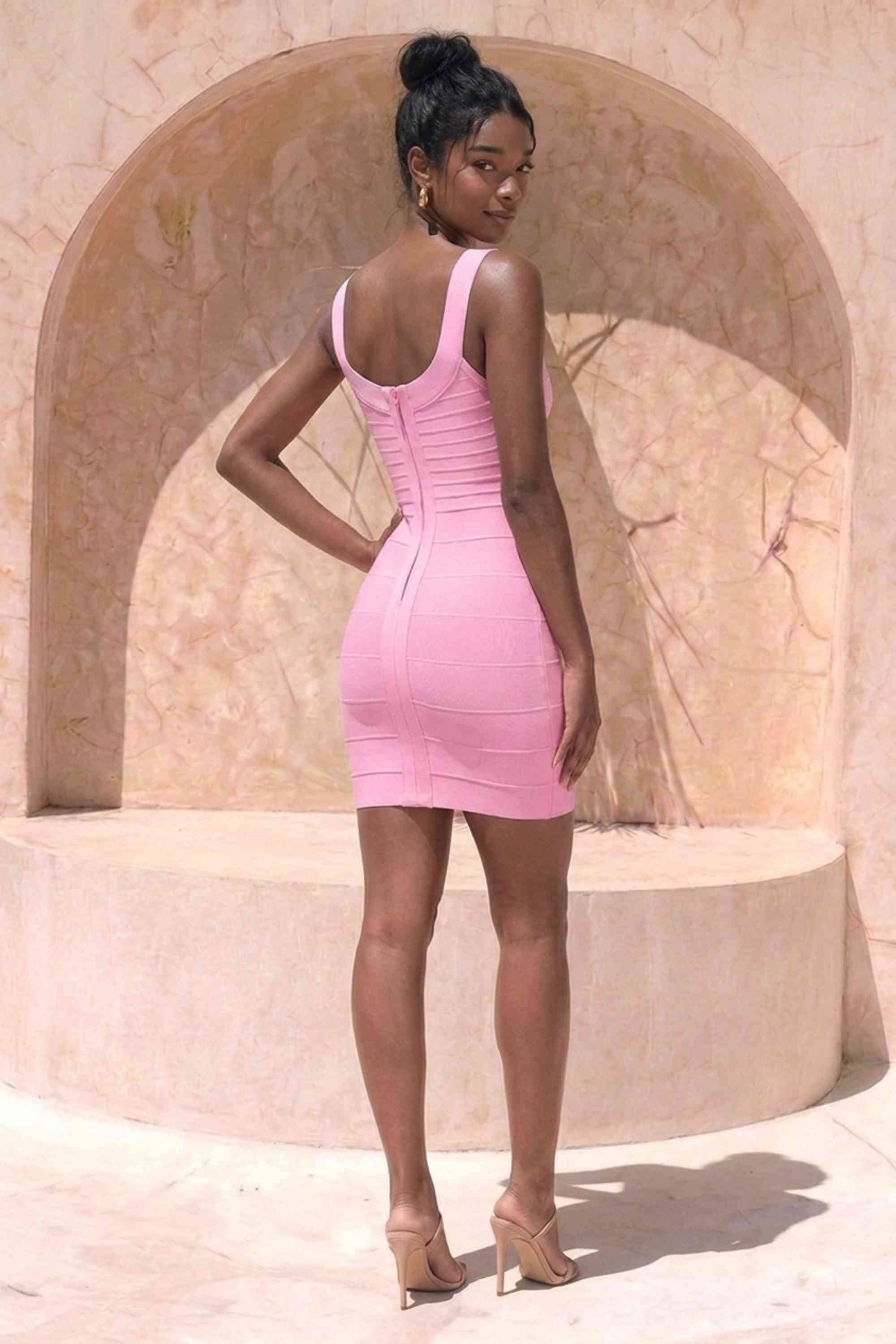 Woman wearing a figure flattering  Cindy Bandage Mini Dress - Blush Pink BODYCON COLLECTION Pty Ltd