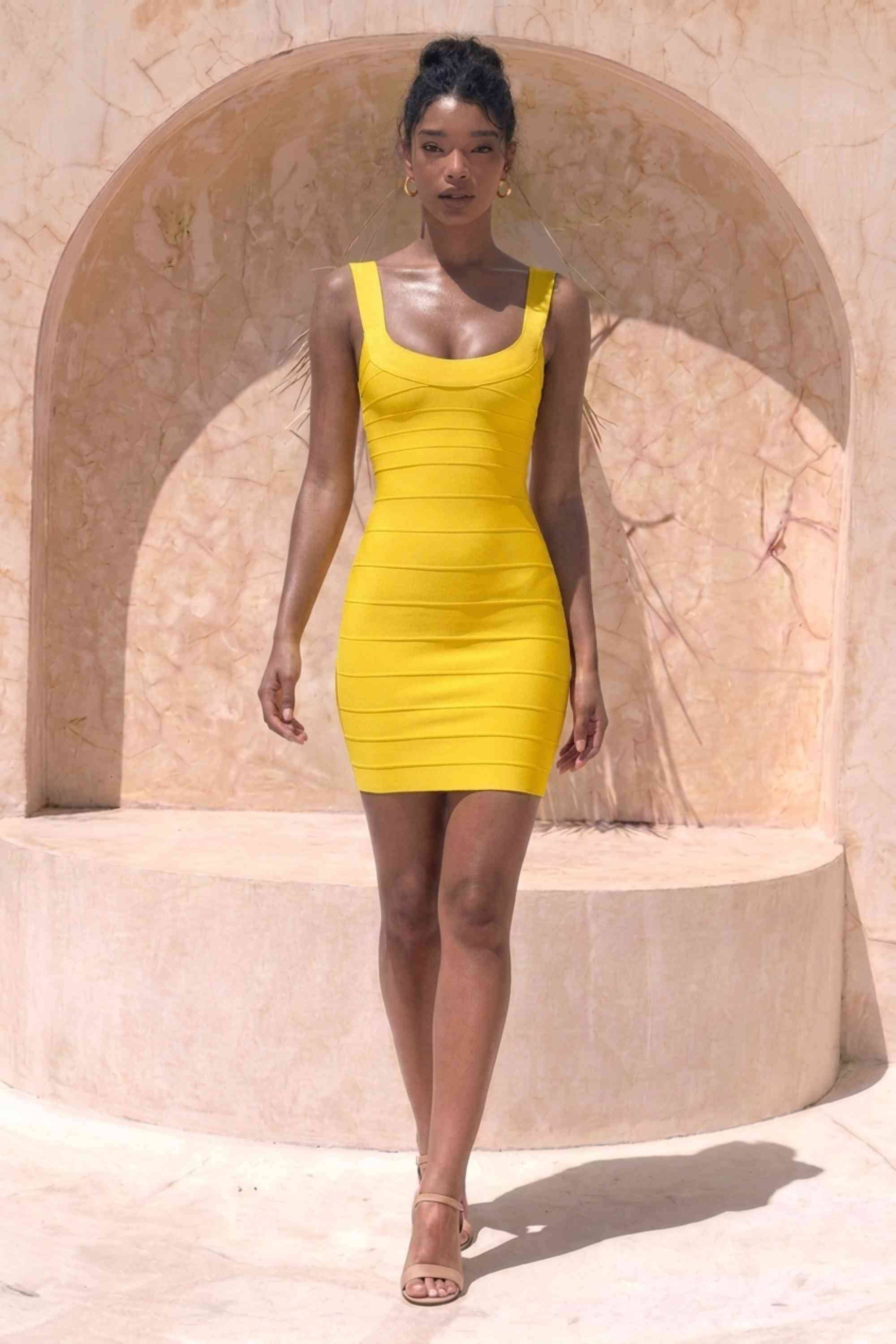Woman wearing a figure flattering  Cindy Bandage Mini Dress - Mustard Yellow BODYCON COLLECTION Pty Ltd