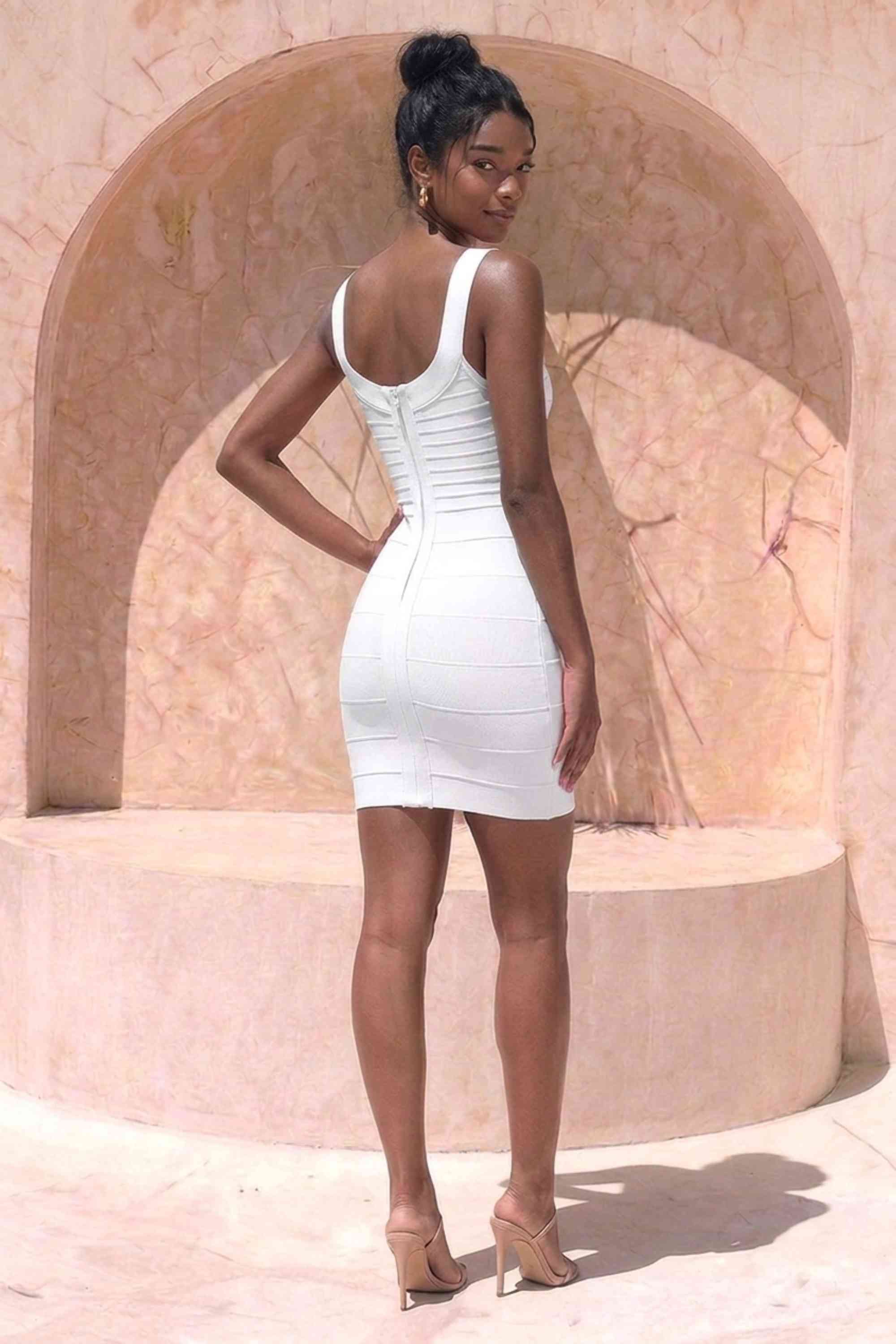Woman wearing a figure flattering  Cindy Bandage Mini Dress - White Pearl BODYCON COLLECTION Pty Ltd