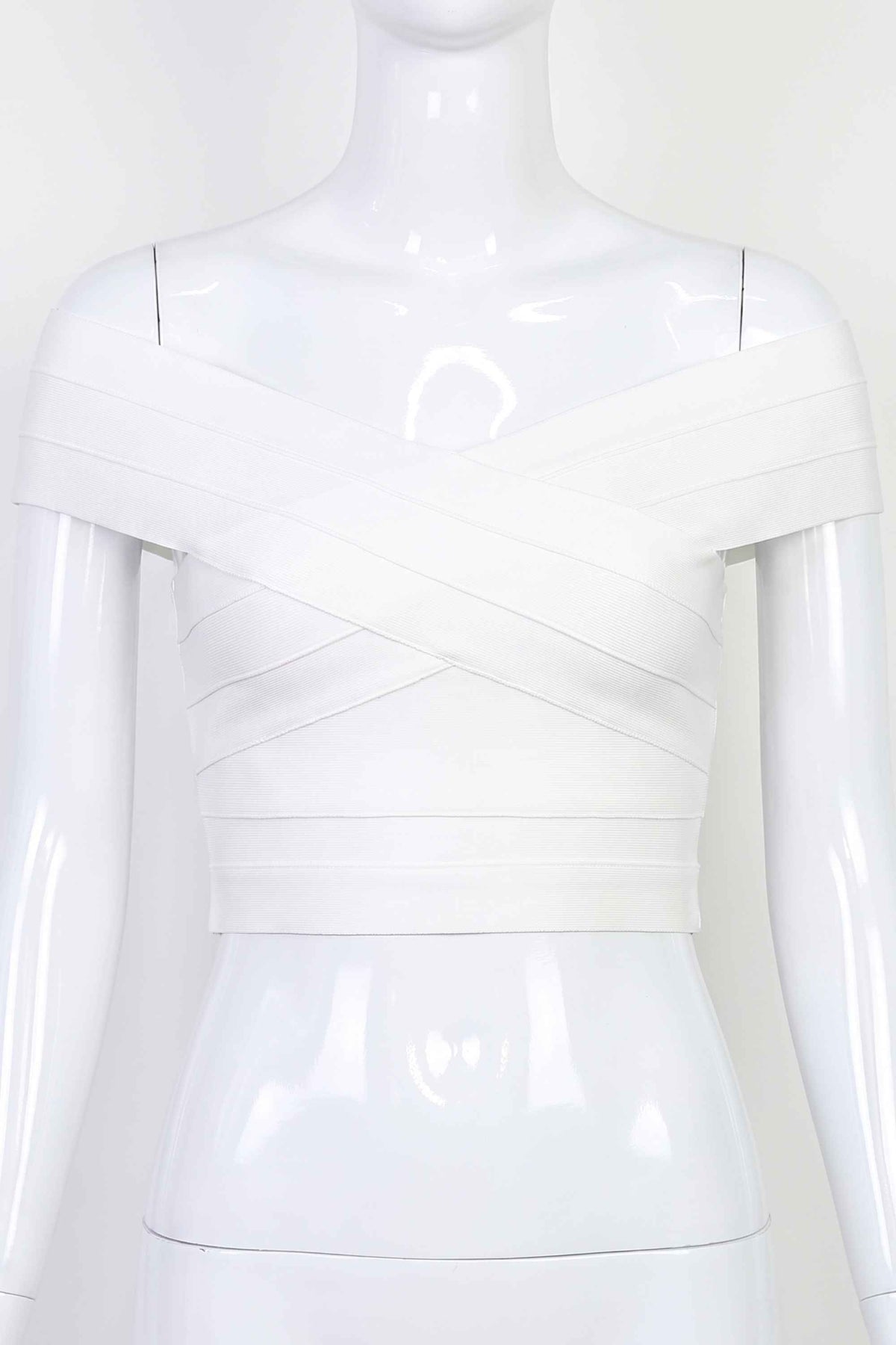 Woman wearing a figure flattering  Cindy Bandage Off Shoulder Crop Top - Pearl White BODYCON COLLECTION