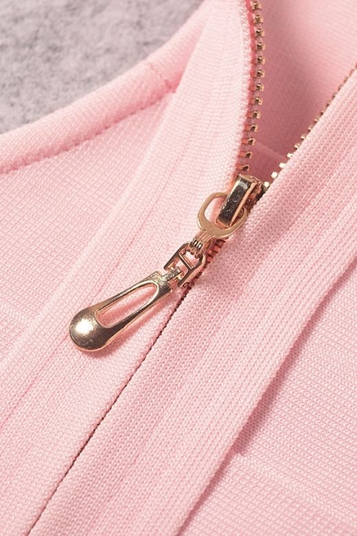 Woman wearing a figure flattering  Elli Bandage Crop Top - Dusty Pink BODYCON COLLECTION