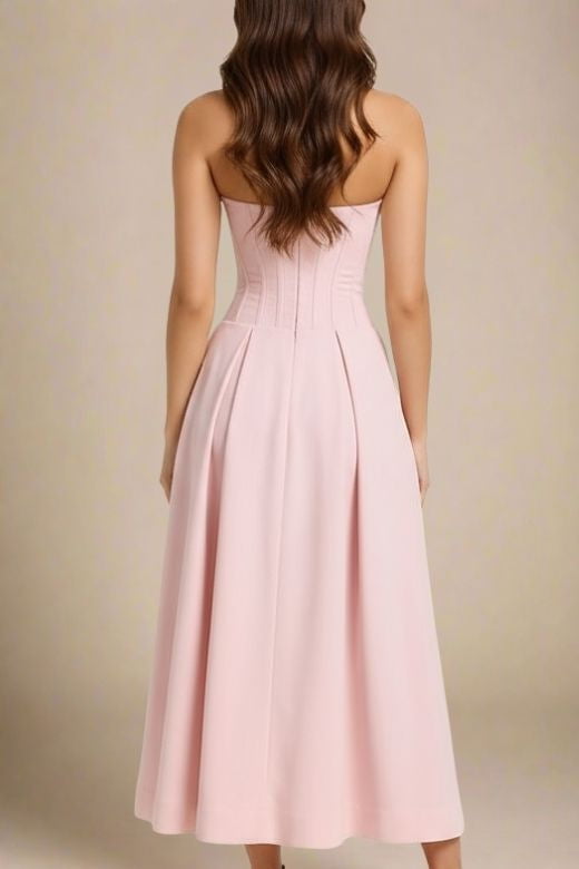 Woman wearing a figure flattering  Gabbi Bodycon Midi Dress - Dusty Pink BODYCON COLLECTION