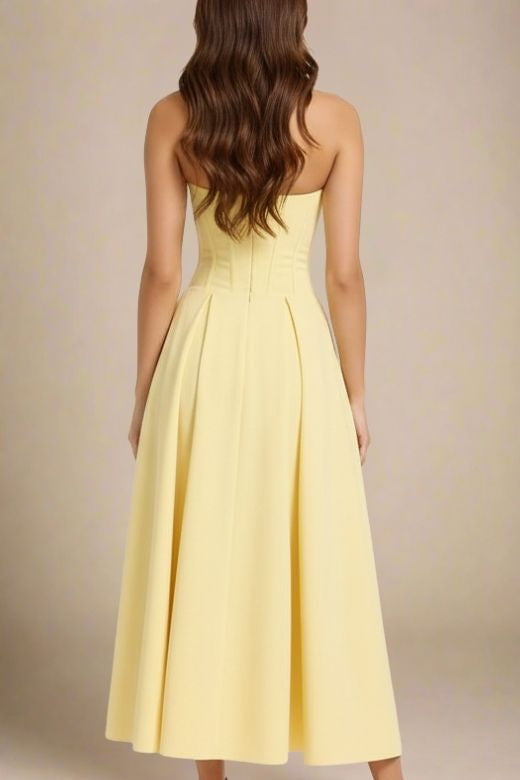 Woman wearing a figure flattering  Gabbi Bodycon Midi Dress - Sun Yellow BODYCON COLLECTION