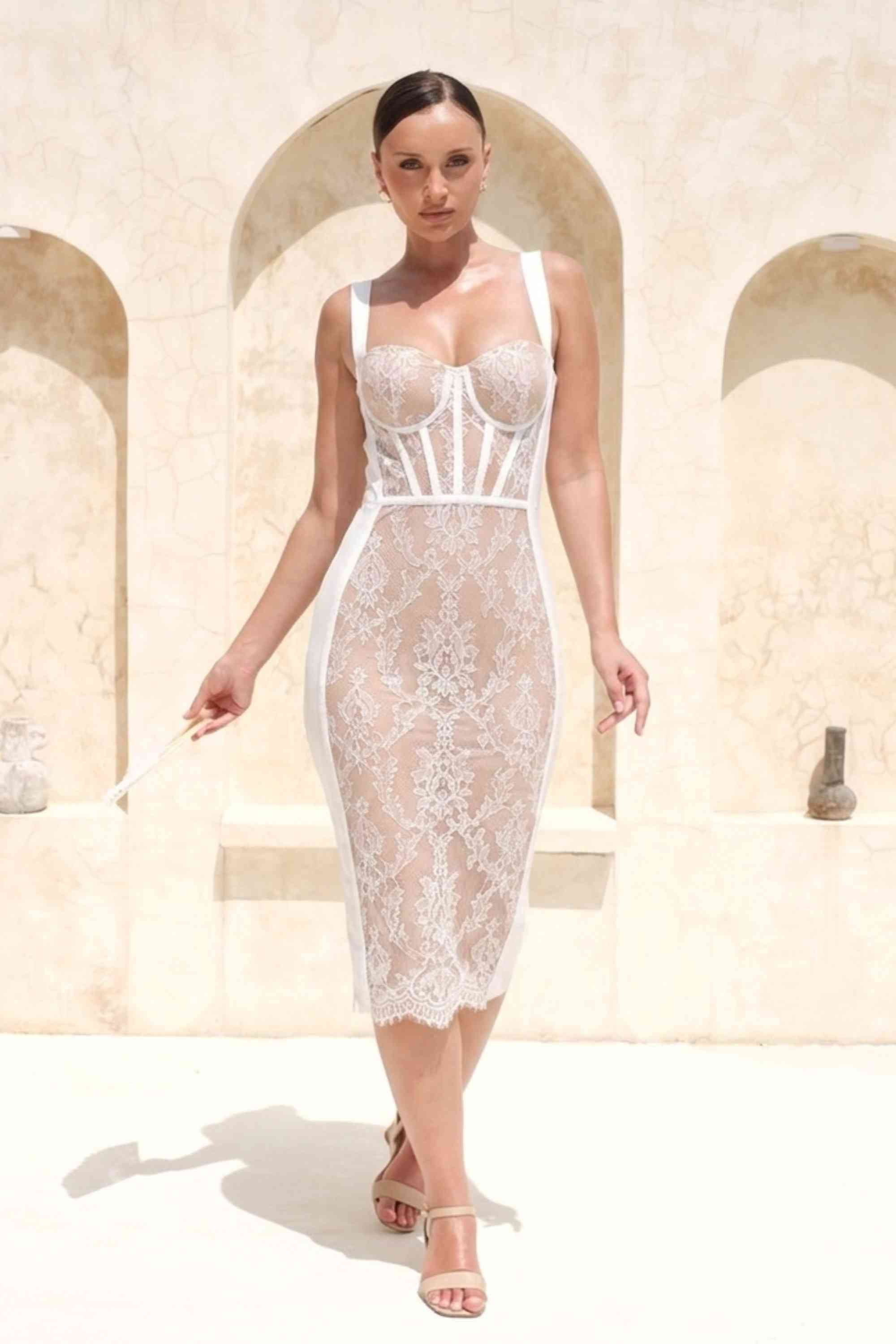 Woman wearing a figure flattering  Genevieve Bodycon Lace Midi Dress - White Pearl BODYCON COLLECTION