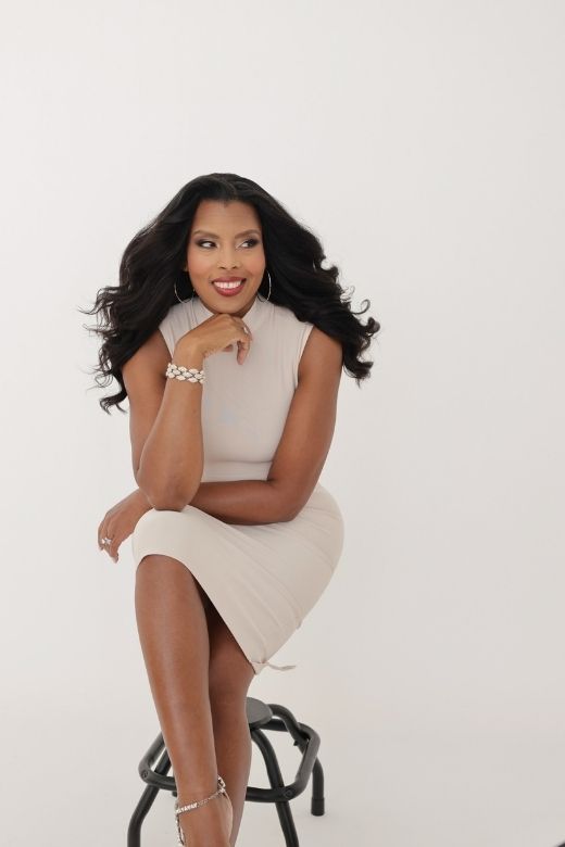 Woman wearing a figure flattering  Grace Bandage Midi Dress - Cream Bodycon Collection