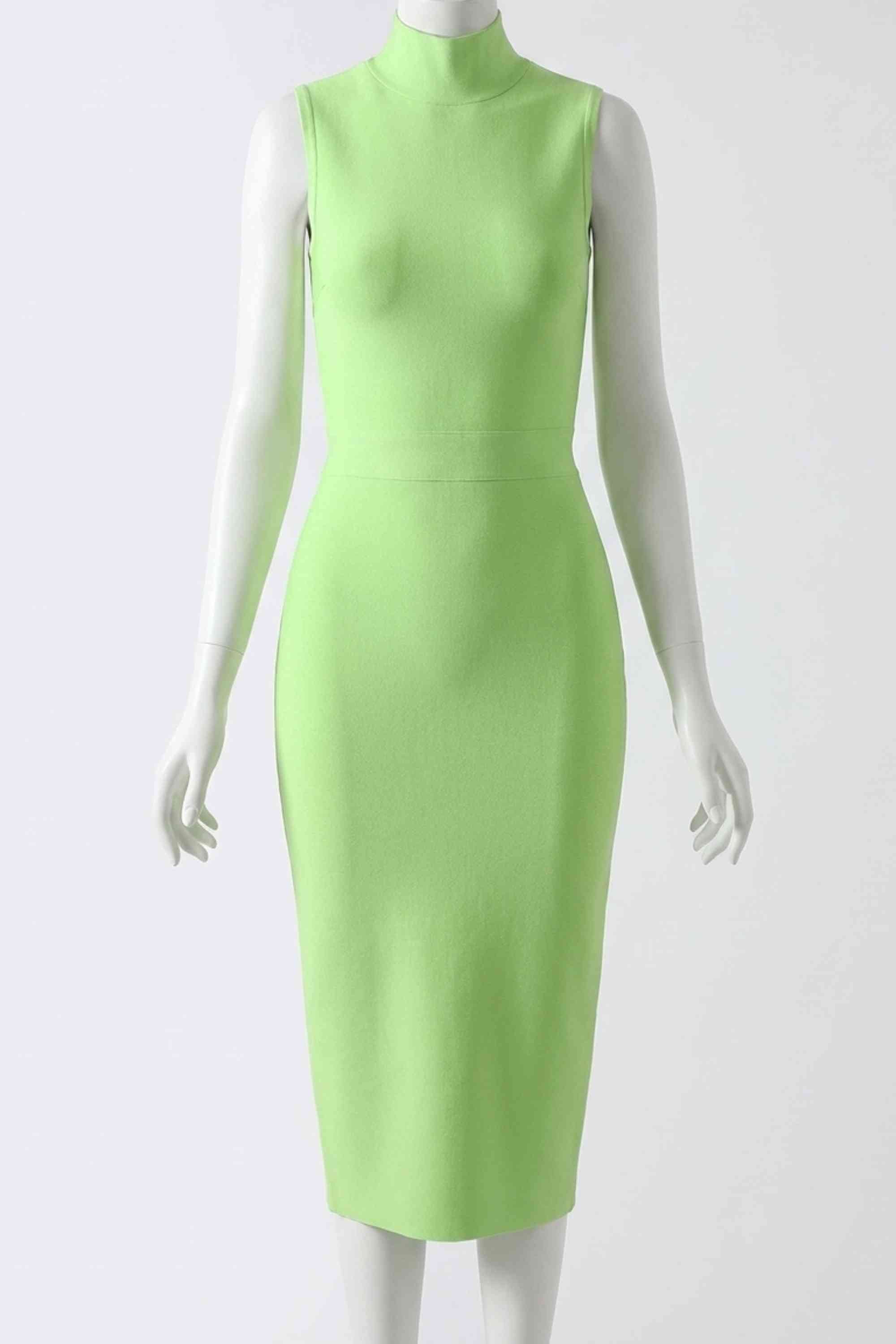 Woman wearing a figure flattering  Grace Bandage Midi Dress - Neon Green Bodycon Collection