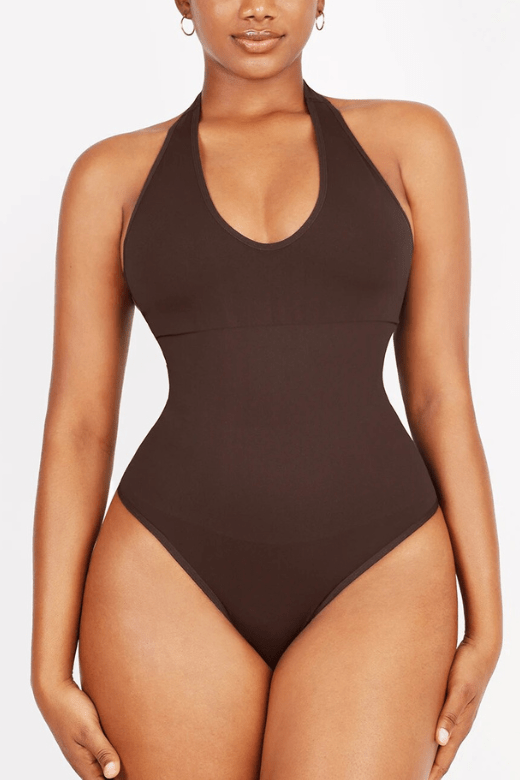 Woman wearing a figure flattering  Halter Neck One Piece Bodysuit Shapewear - Thong BODYCON COLLECTION