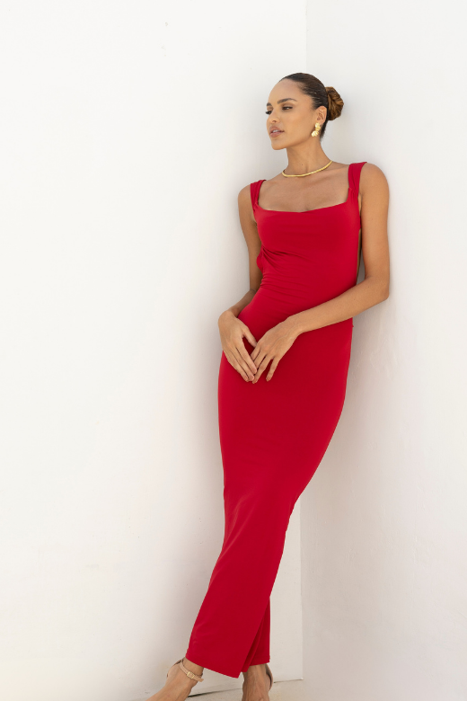 Woman wearing a figure flattering  Harper Bodycon Maxi Dress - Classic Black BODYCON COLLECTION