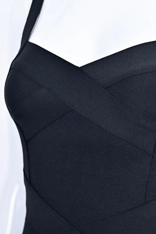 Woman wearing a figure flattering  Heidi Bandage Midi Dress - Classic Black Bodycon Collection