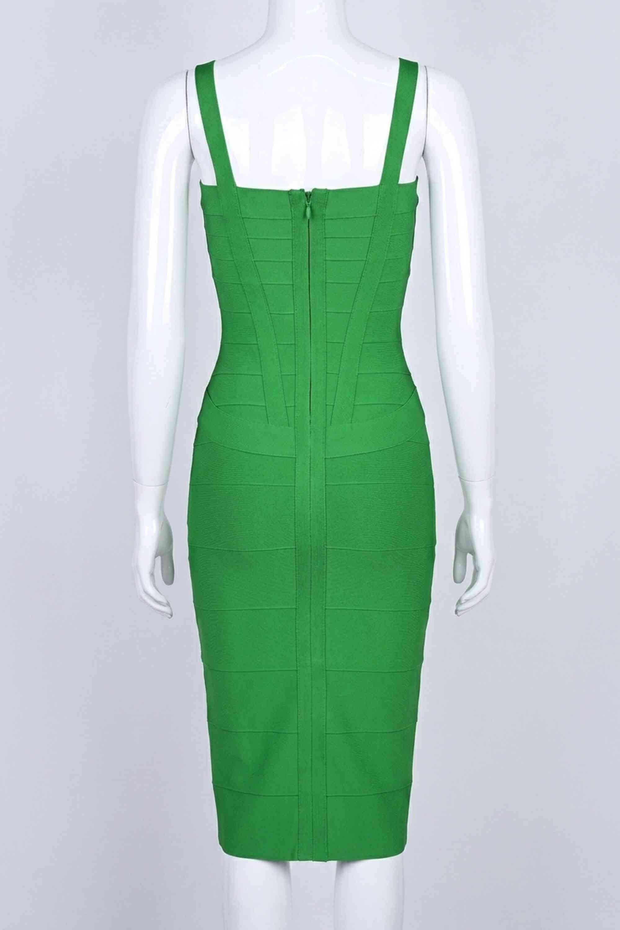 Woman wearing a figure flattering  Heidi Bandage Midi Dress - Emerald Green Bodycon Collection