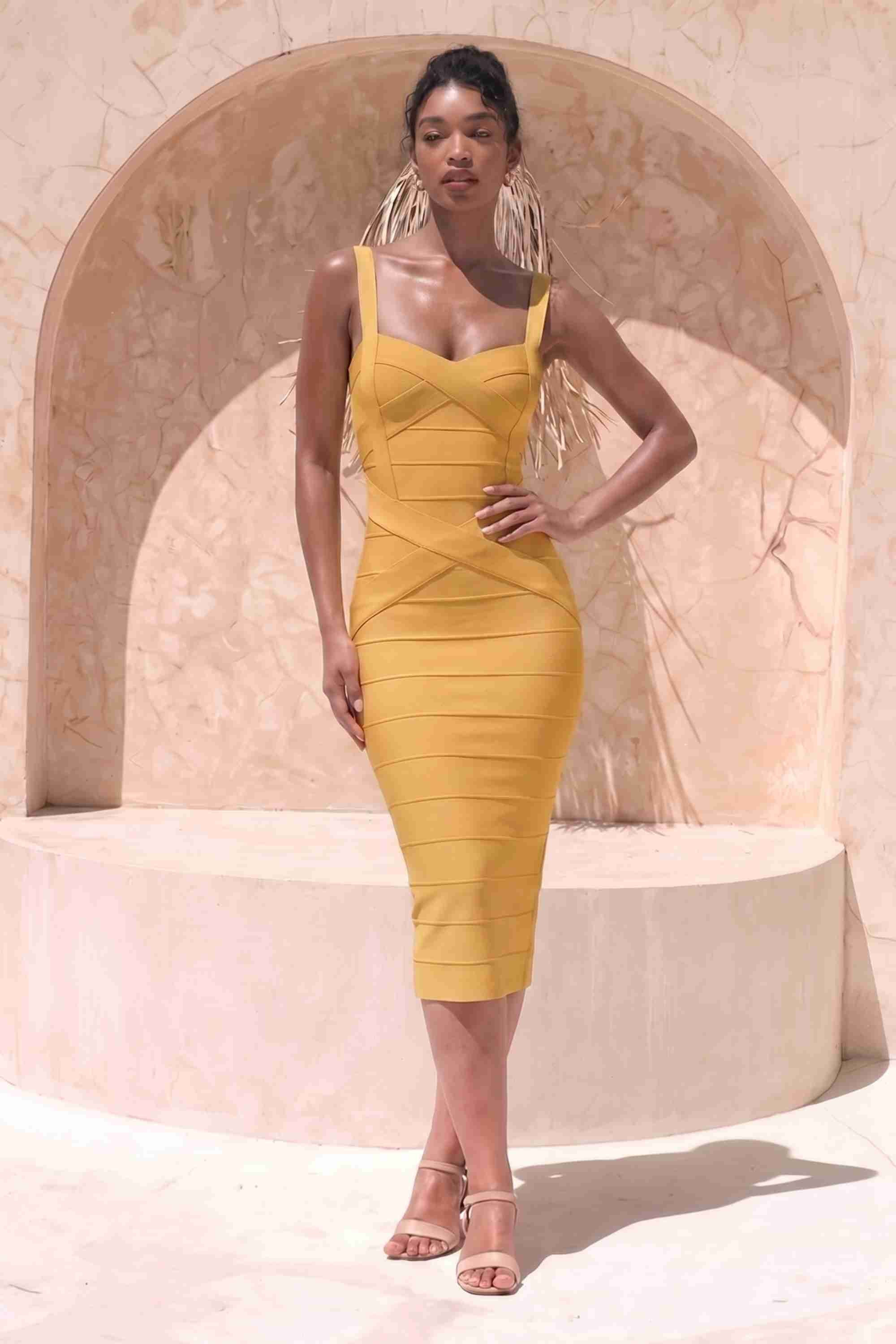 Woman wearing a mustard yellow party dress Heidi Bandage Midi Dress - Mustard Yellow Bodycon Collection