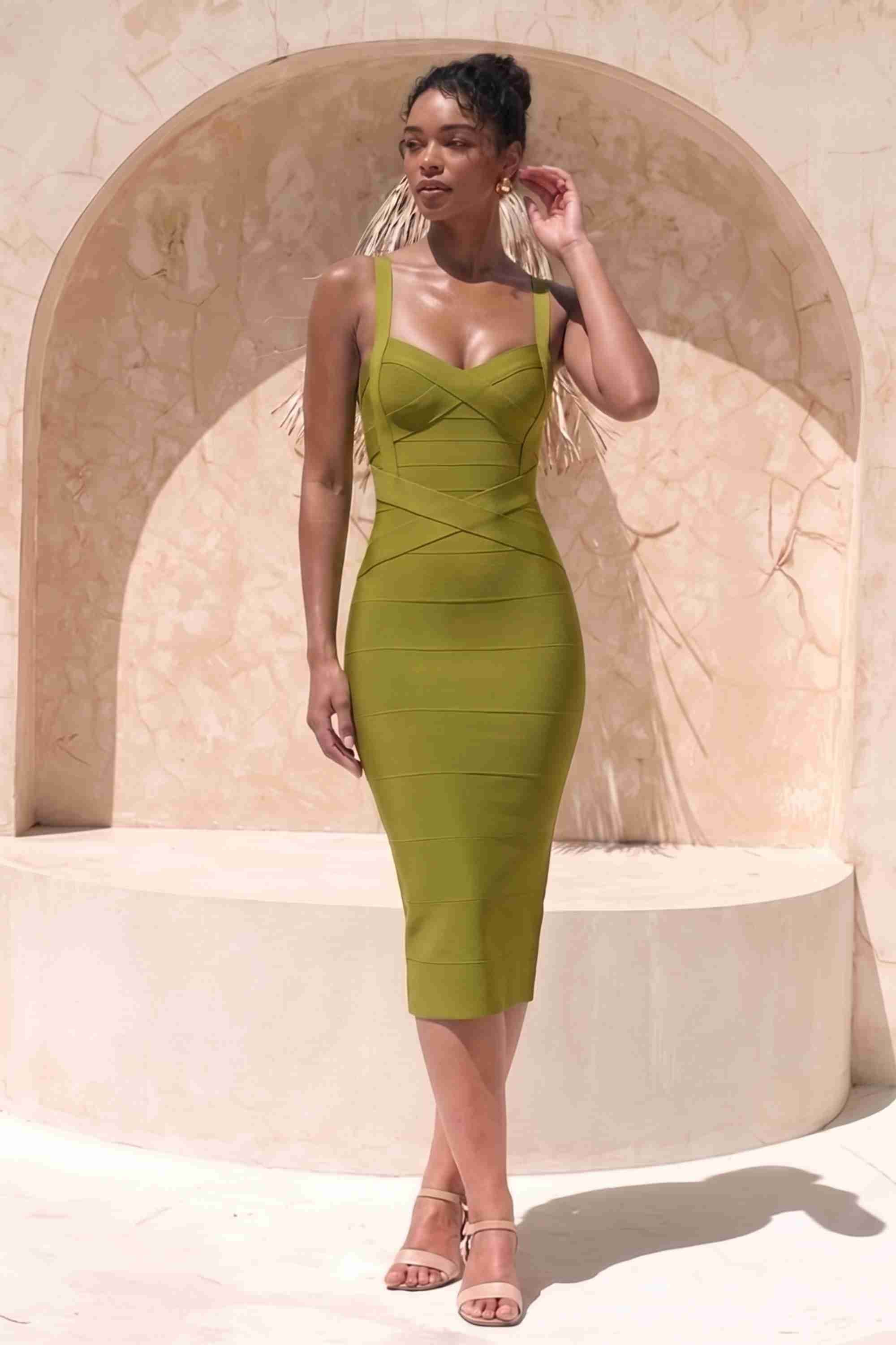 Woman wearing a figure flattering  Heidi Bandage Midi Dress - Olive Green Bodycon Collection