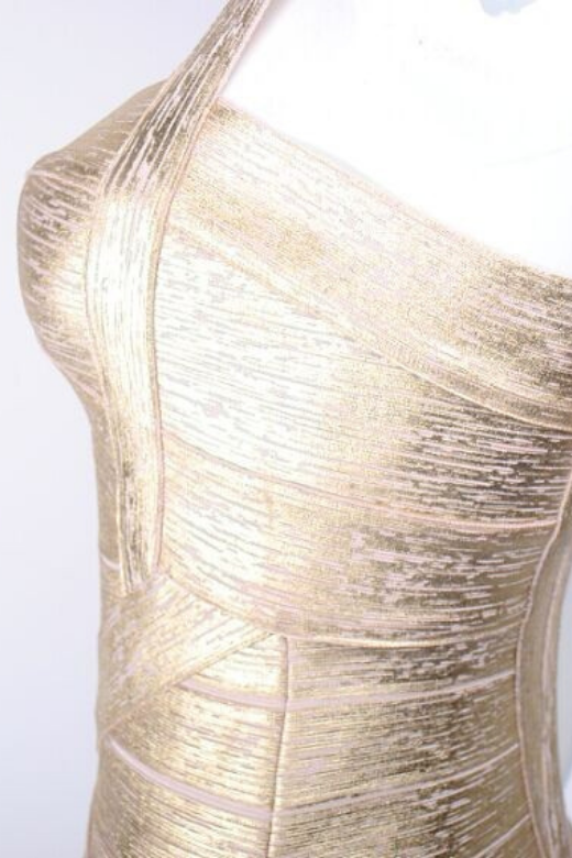 Woman wearing a figure flattering  Heidi Bandage Mini Dress - Gold Bodycon Collection