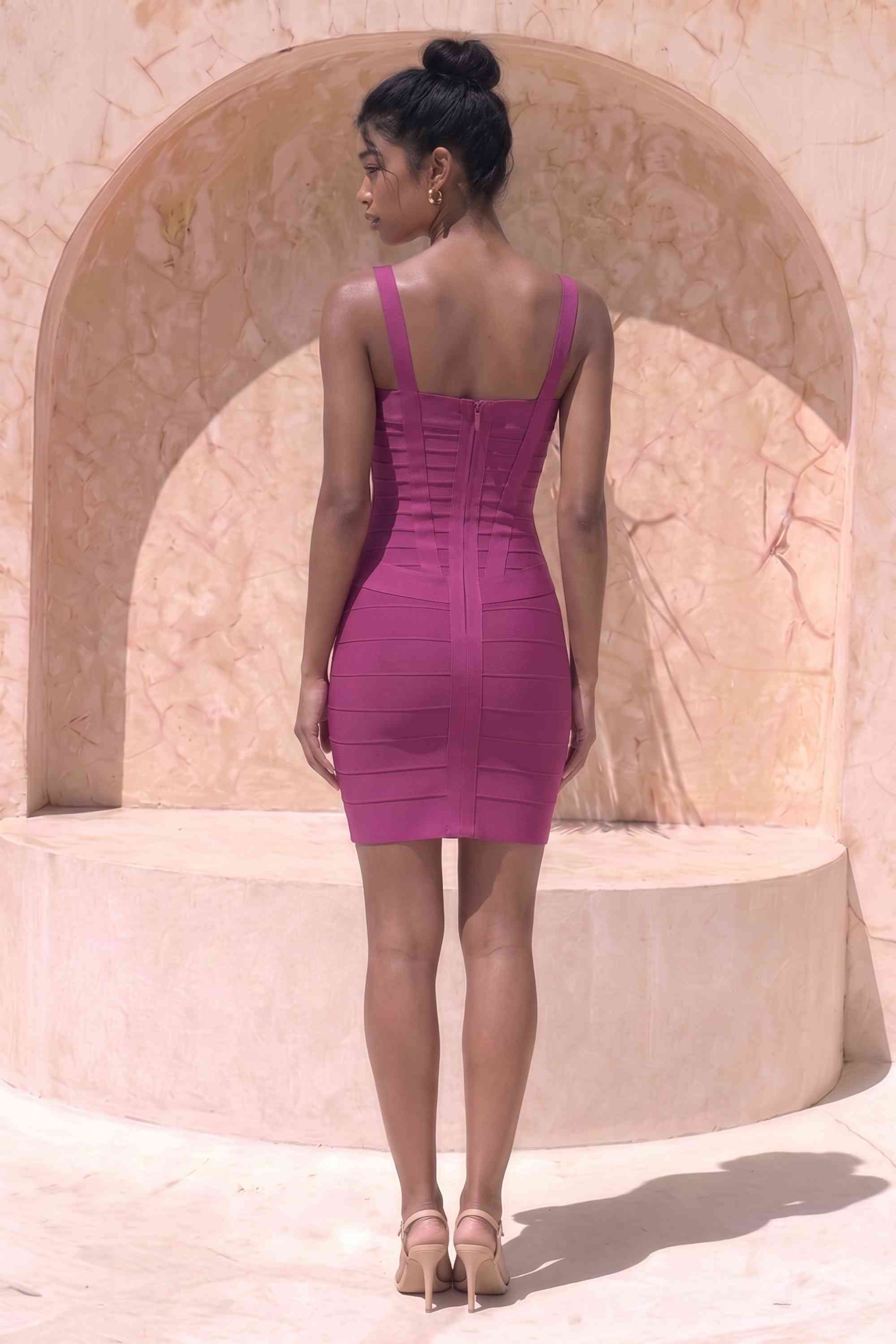 Woman wearing a figure flattering  Heidi Bandage Mini Dress - Magenta Pink Bodycon Collection