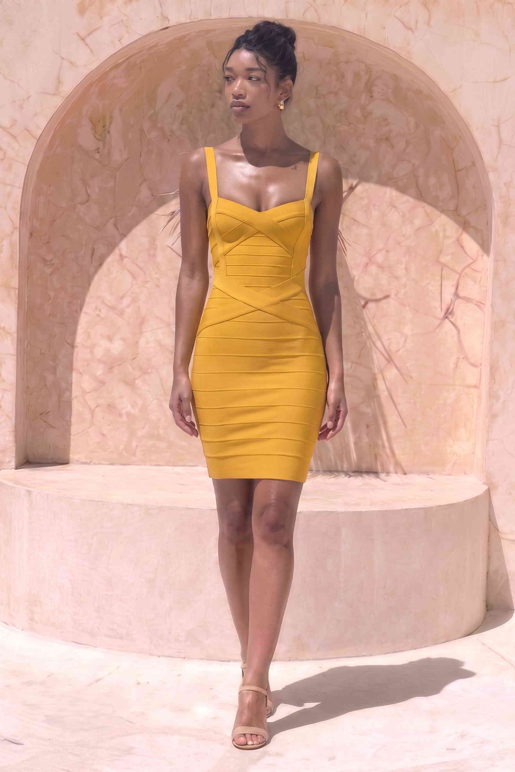 Woman wearing a figure flattering  Heidi Bandage Mini Dress - Mustard Yellow Bodycon Collection