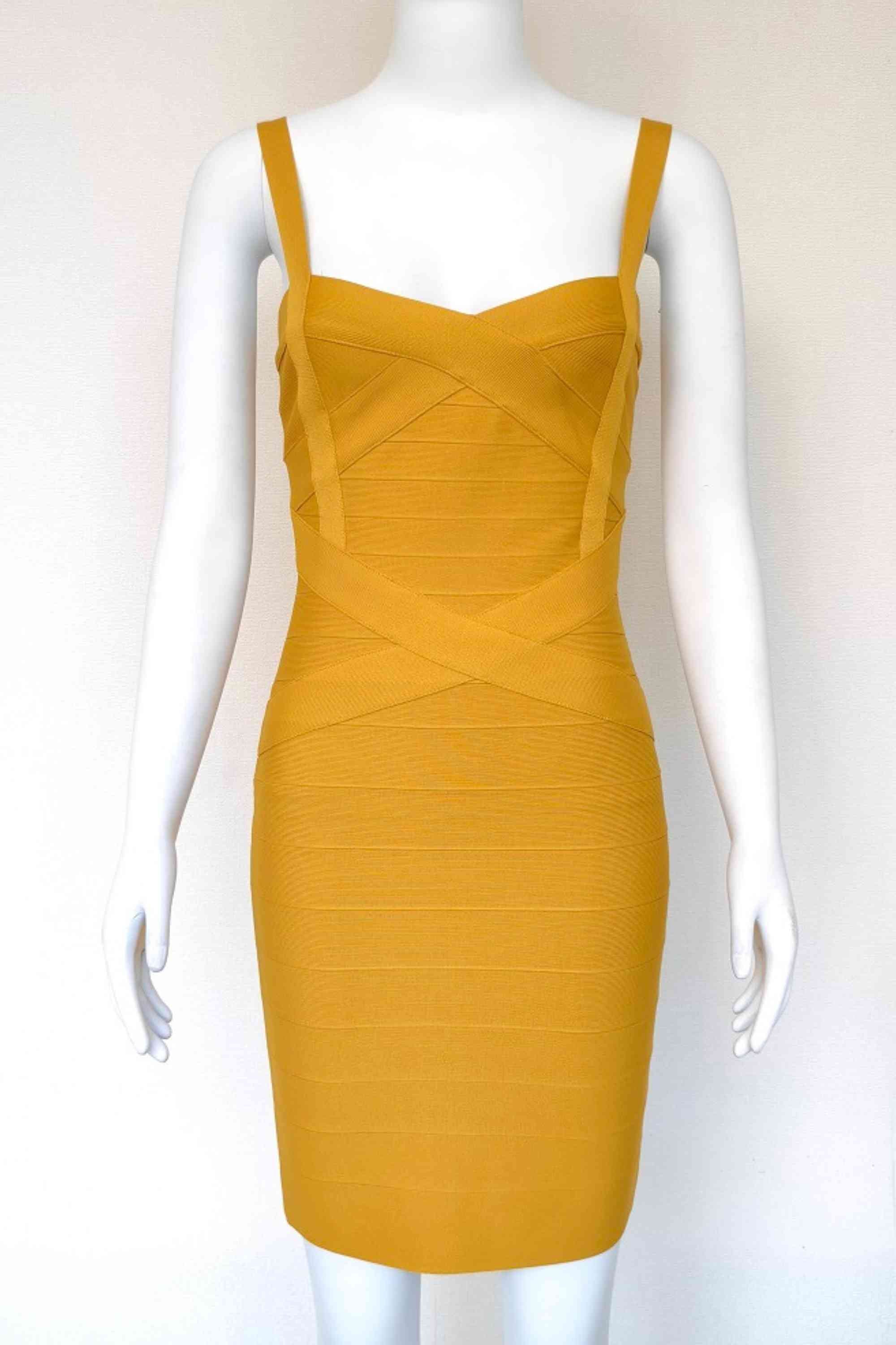 Woman wearing a figure flattering  Heidi Bandage Mini Dress - Mustard Yellow Bodycon Collection