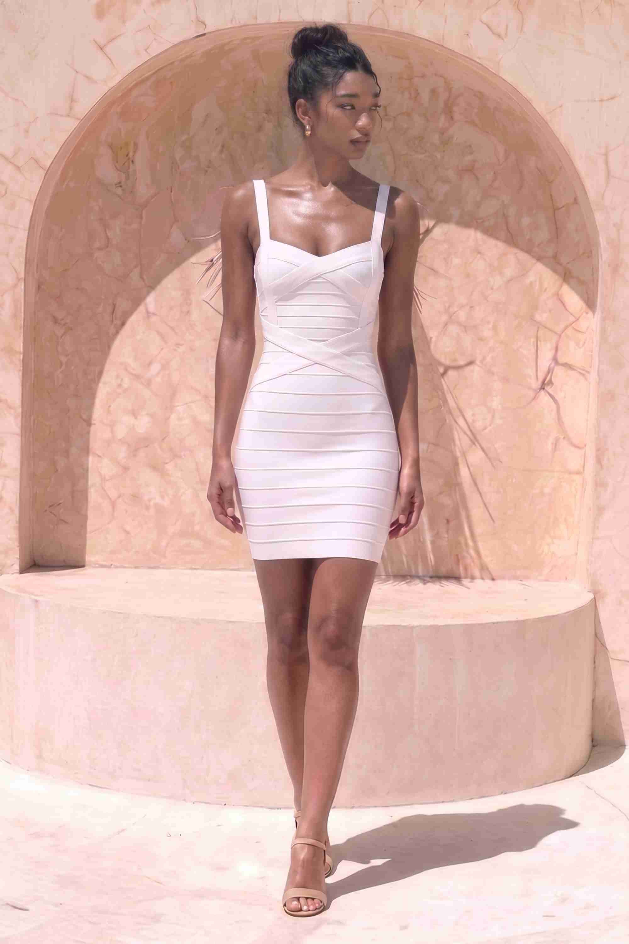 Woman wearing a figure flattering  Heidi Bandage Mini Dress - Pearl White Bodycon Collection
