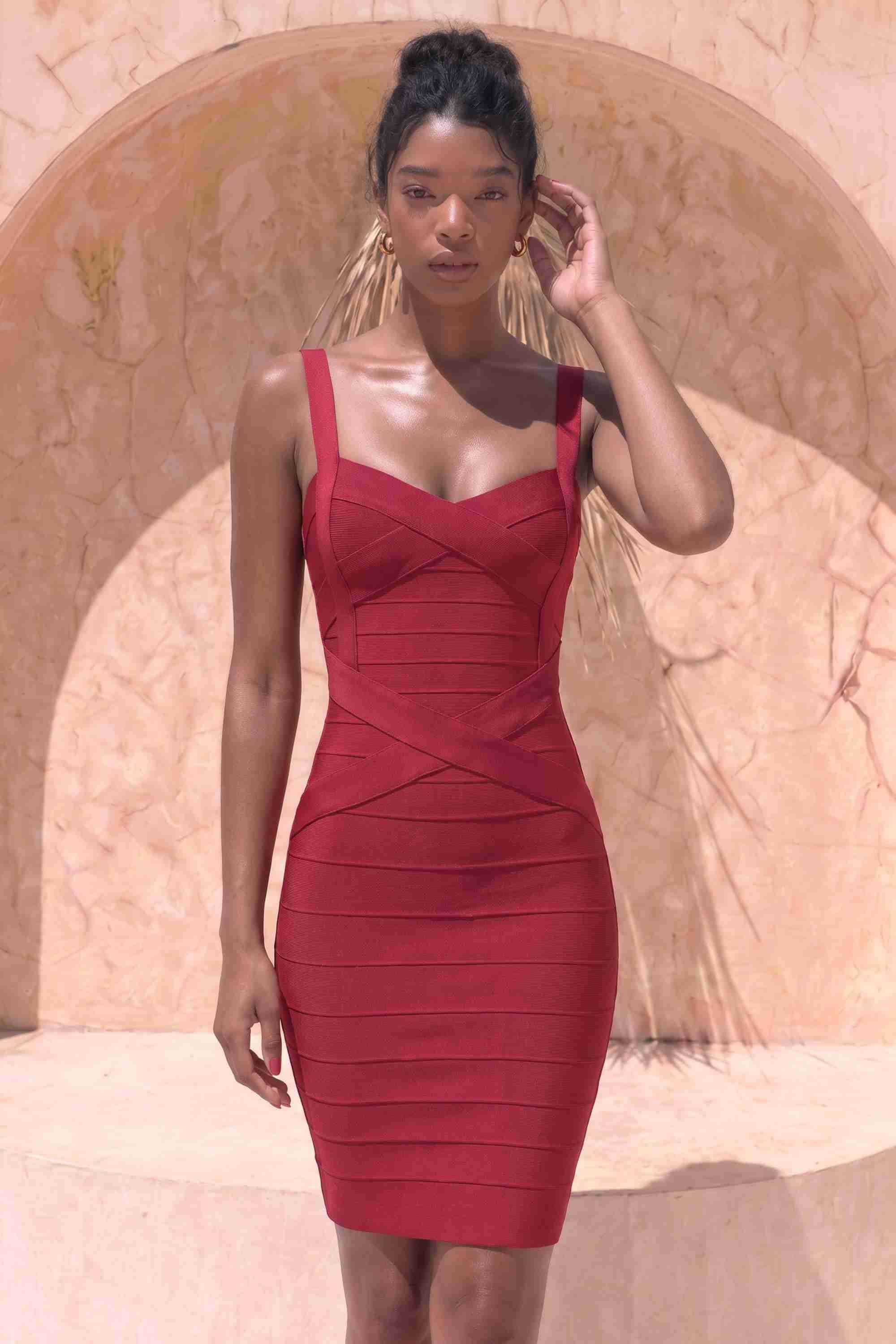 Woman wearing a figure flattering  Heidi Bandage Mini Dress - Red Wine Bodycon Collection