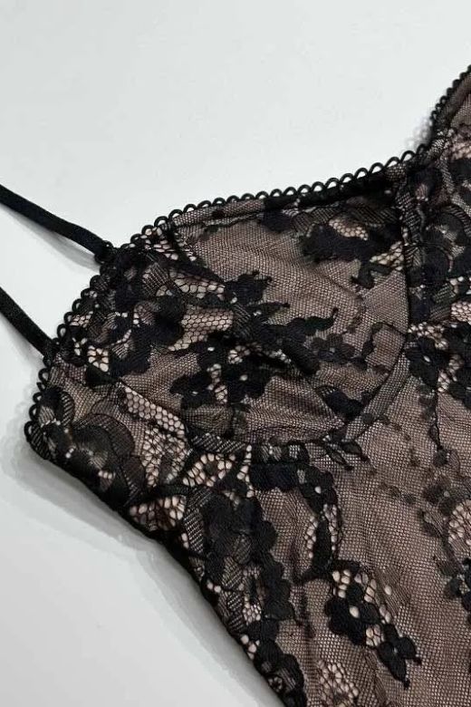 Woman wearing a figure flattering  Joan Bodycon Dress - Classic Black BODYCON COLLECTION