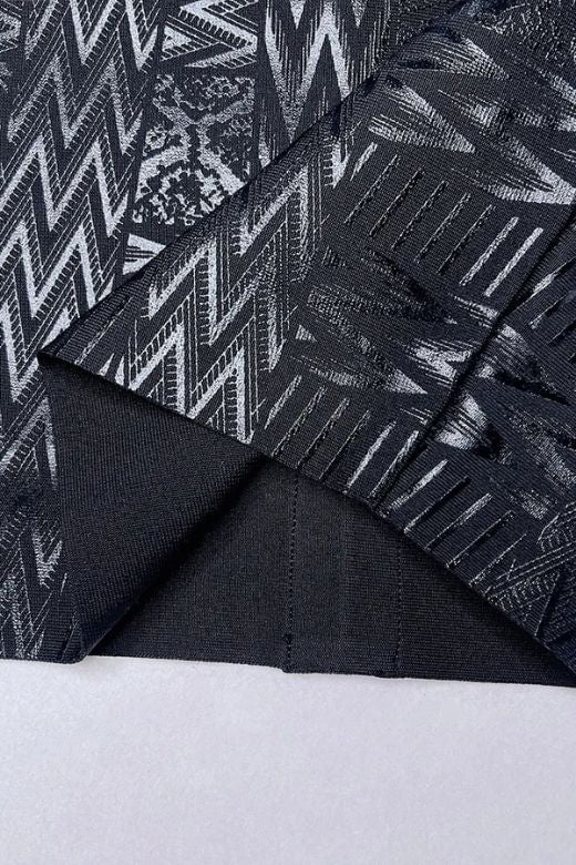 Woman wearing a figure flattering  High Waist Metallic Mini Skirt - Classic Black BODYCON COLLECTION