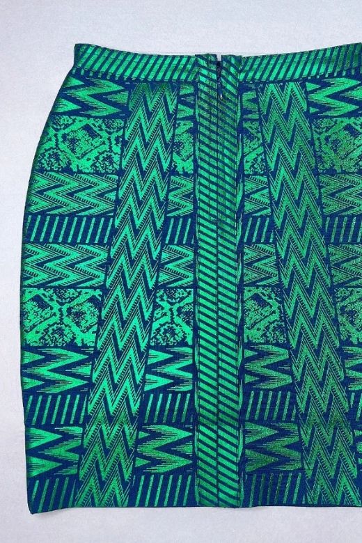 Woman wearing a figure flattering  High Waist Metallic Mini Skirt - Emerald Green BODYCON COLLECTION