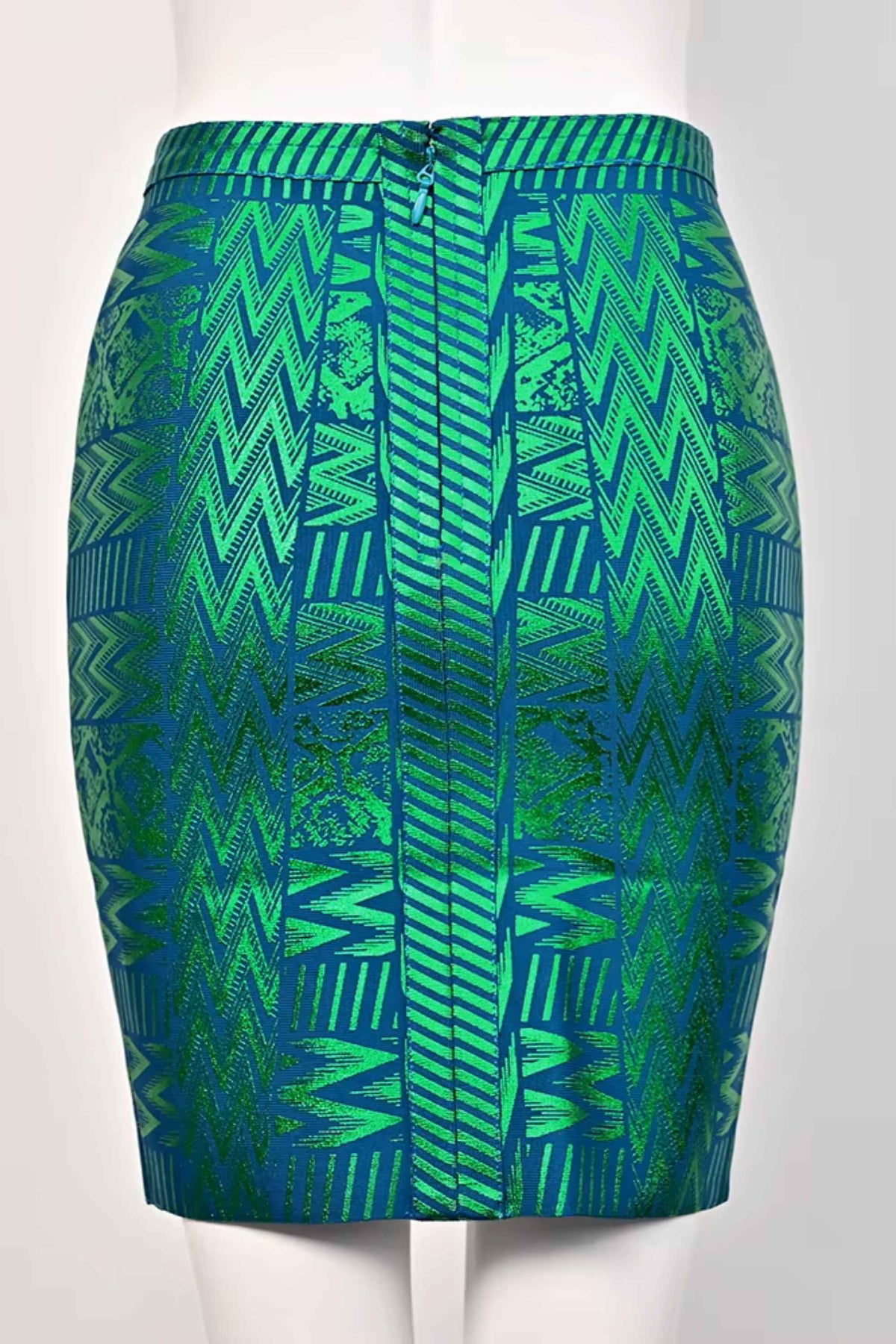 Woman wearing a figure flattering  High Waist Metallic Mini Skirt - Emerald Green BODYCON COLLECTION
