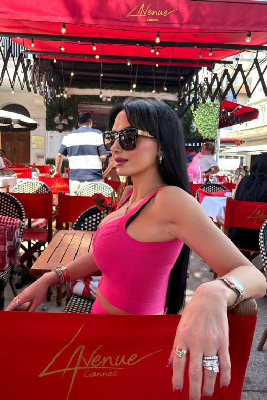 Woman wearing a figure flattering  India Bandage Top and Mini Skirt Outfit Set - Hot Pink BODYCON COLLECTION