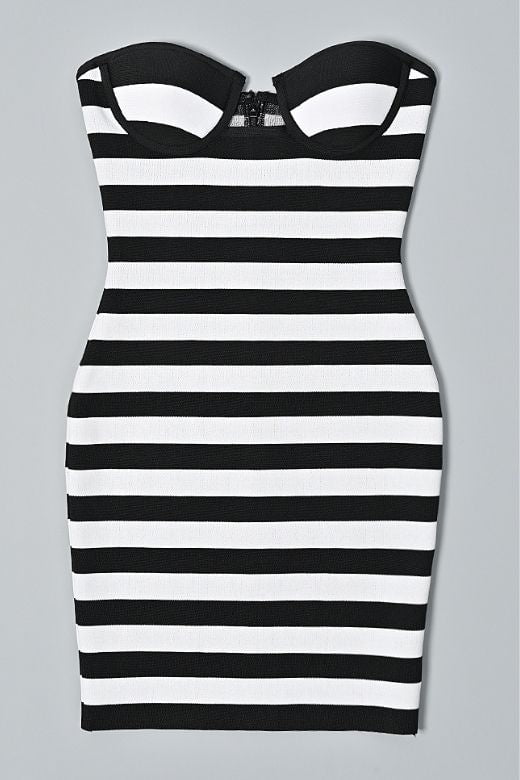 Woman wearing a figure flattering  Ingrid Bandage Mini Dress - Classic Black BODYCON COLLECTION