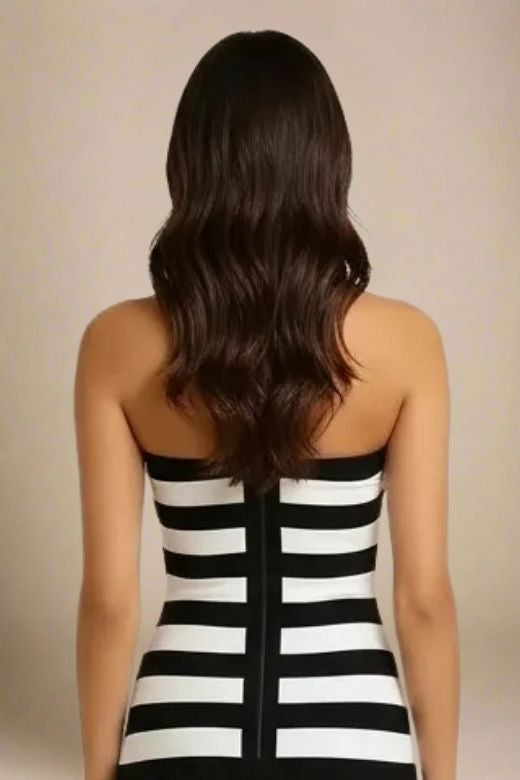 Woman wearing a figure flattering  Ingrid Bandage Mini Dress - Classic Black BODYCON COLLECTION