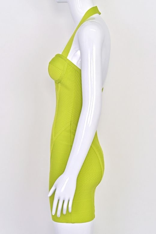 Woman wearing a figure flattering  Isabella Bandage Mini Dress - Neon Green BODYCON COLLECTION Pty Ltd