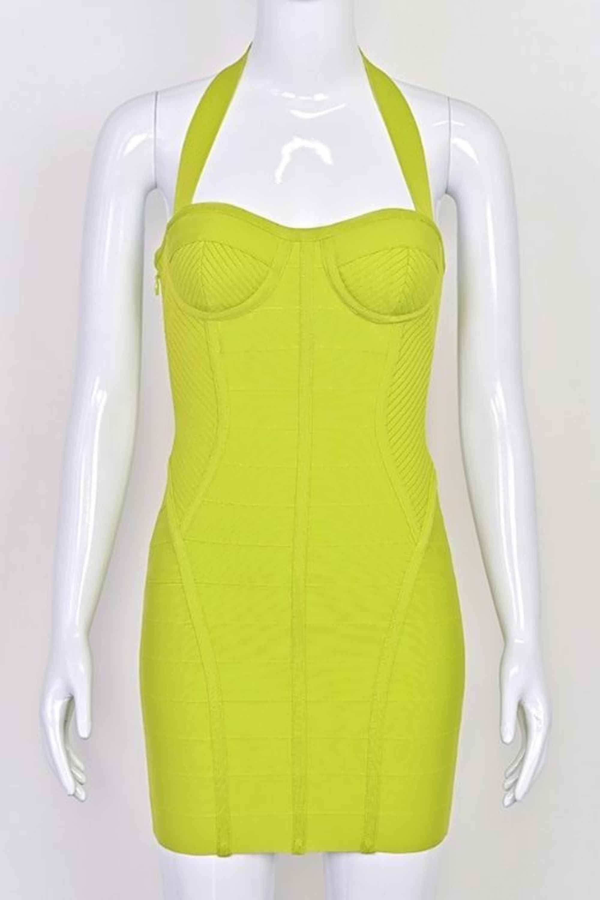 Woman wearing a figure flattering  Isabella Bandage Mini Dress - Neon Green BODYCON COLLECTION Pty Ltd