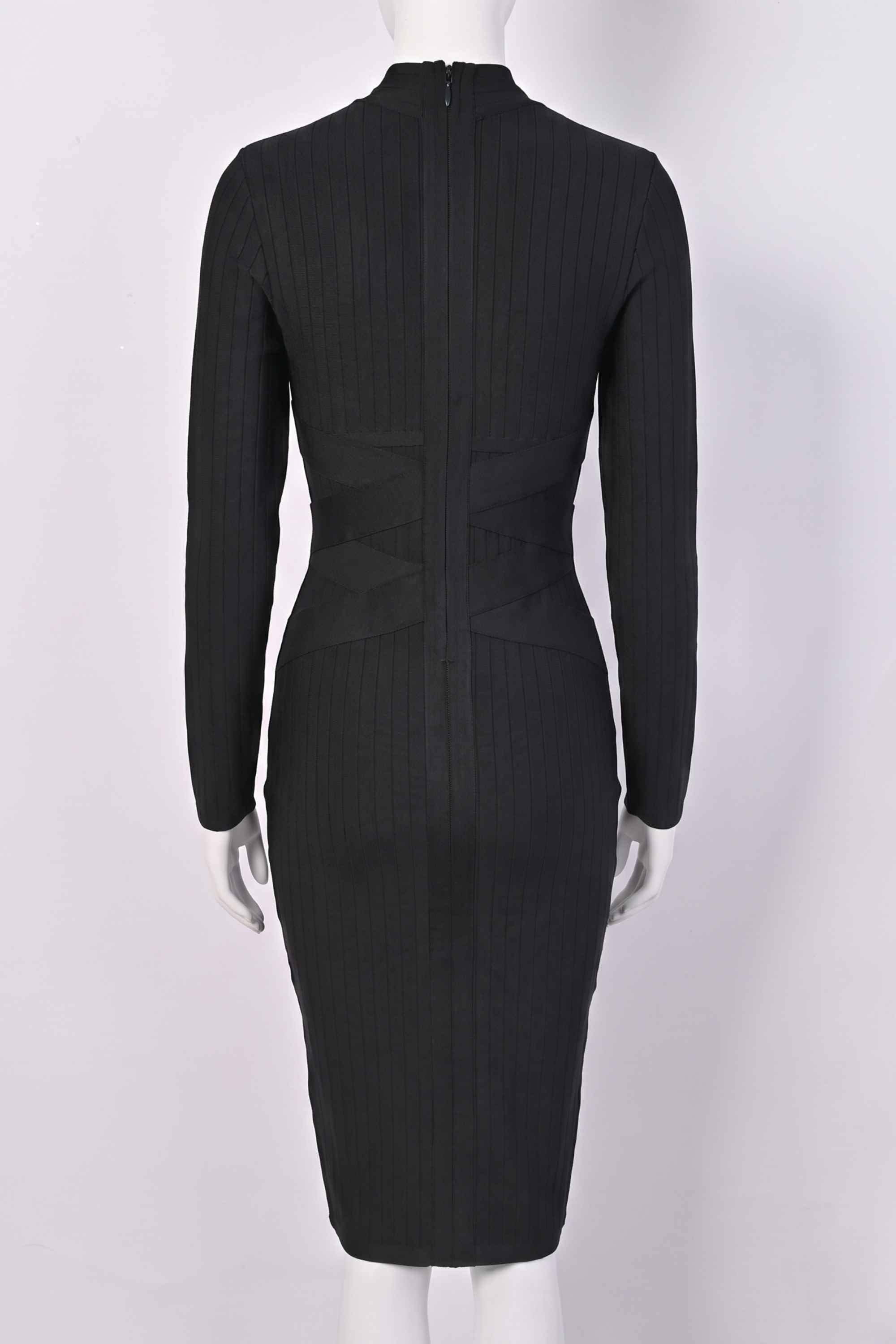 Woman wearing a figure flattering  Jane Long Sleeve Bodycon Midi Dress - Classic Black Bodycon Collection