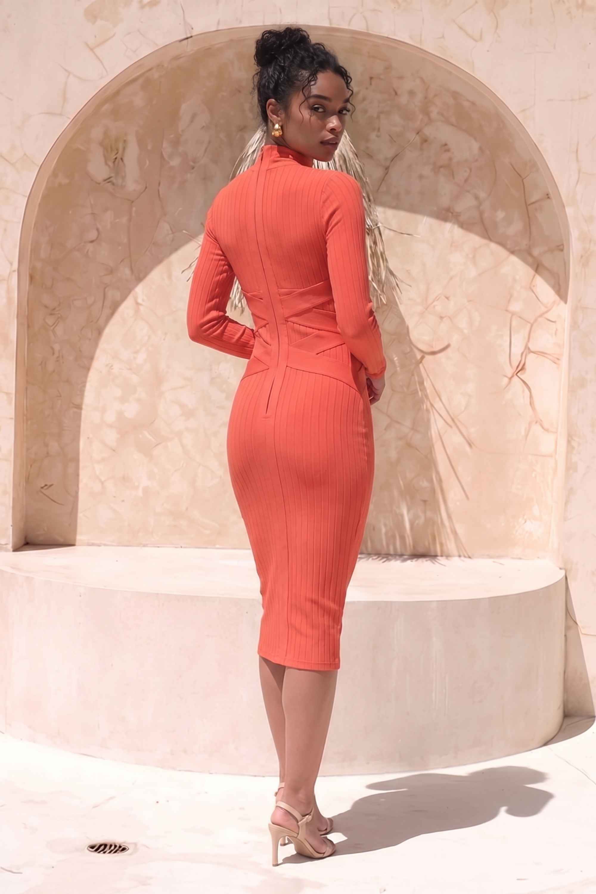 Woman wearing a figure flattering  Jane Long Sleeve Bodycon Midi Dress - Lipstick Red Bodycon Collection
