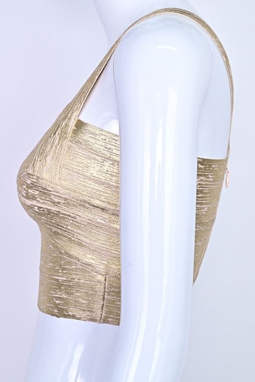Woman wearing a figure flattering  Jay Bandage Leather Crop Top - Gold BODYCON COLLECTION