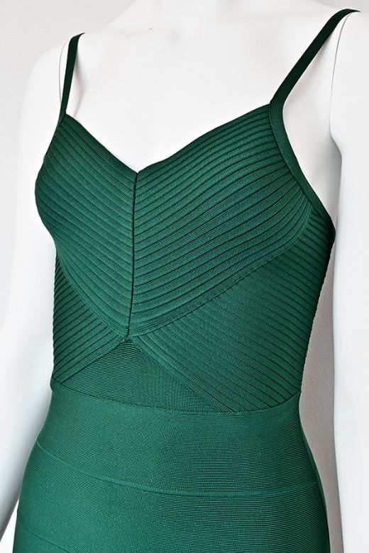 Woman wearing a figure flattering  Jene Bandage Dress - Emerald Green BODYCON COLLECTION