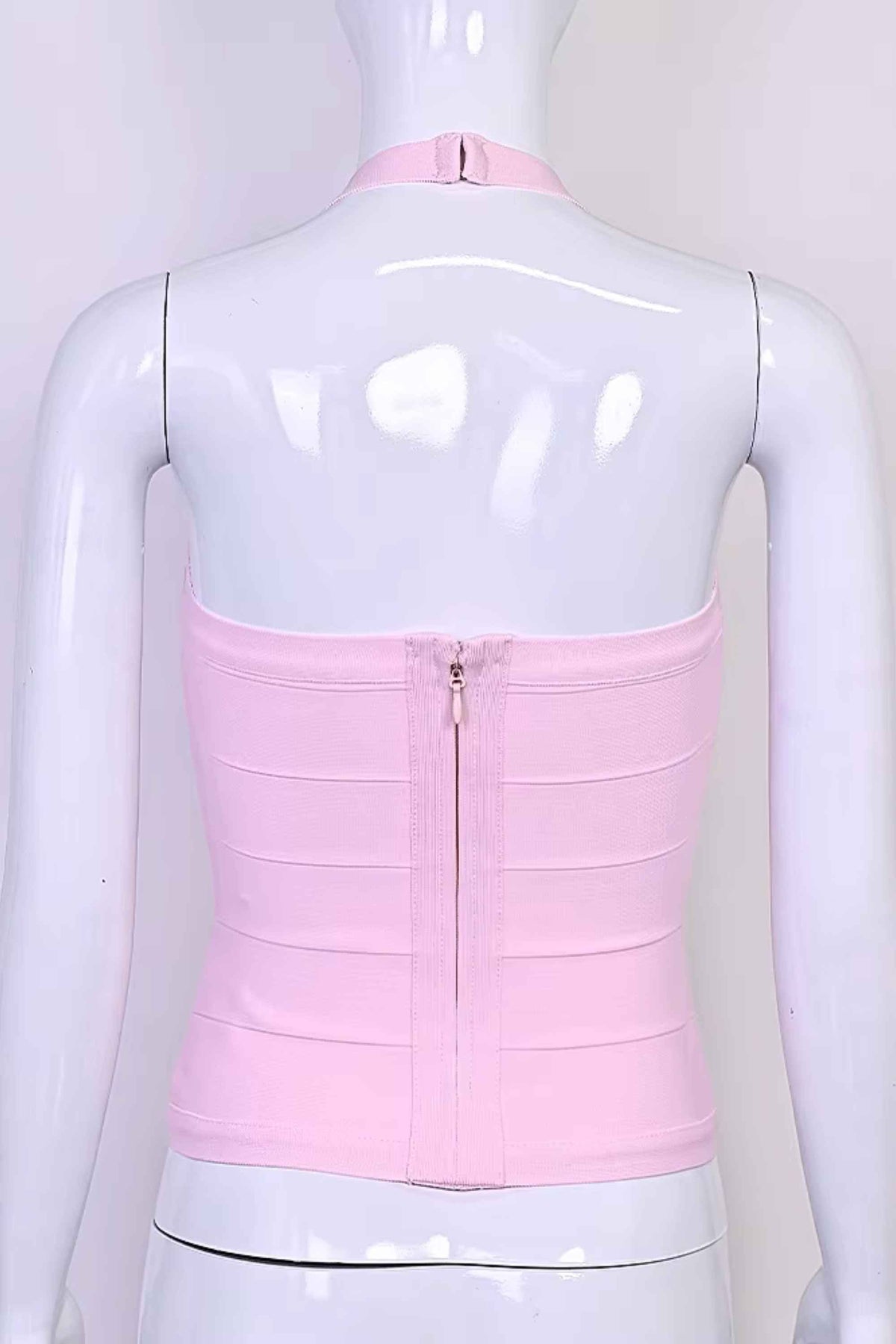 Woman wearing a figure flattering  Jenna Bandage Top - Dusty Pink BODYCON COLLECTION Pty Ltd