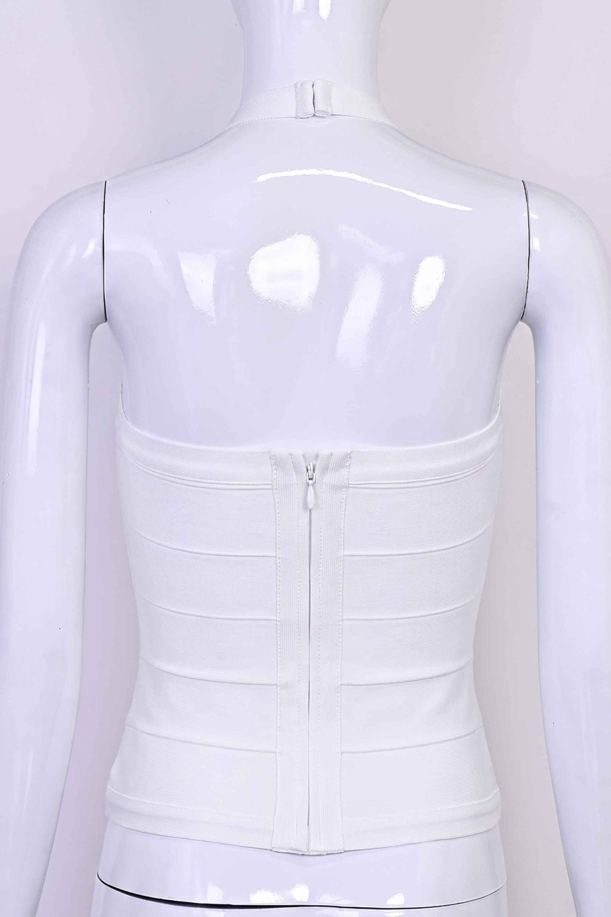 Woman wearing a figure flattering  Jenna Bandage Top - White Pearl BODYCON COLLECTION Pty Ltd