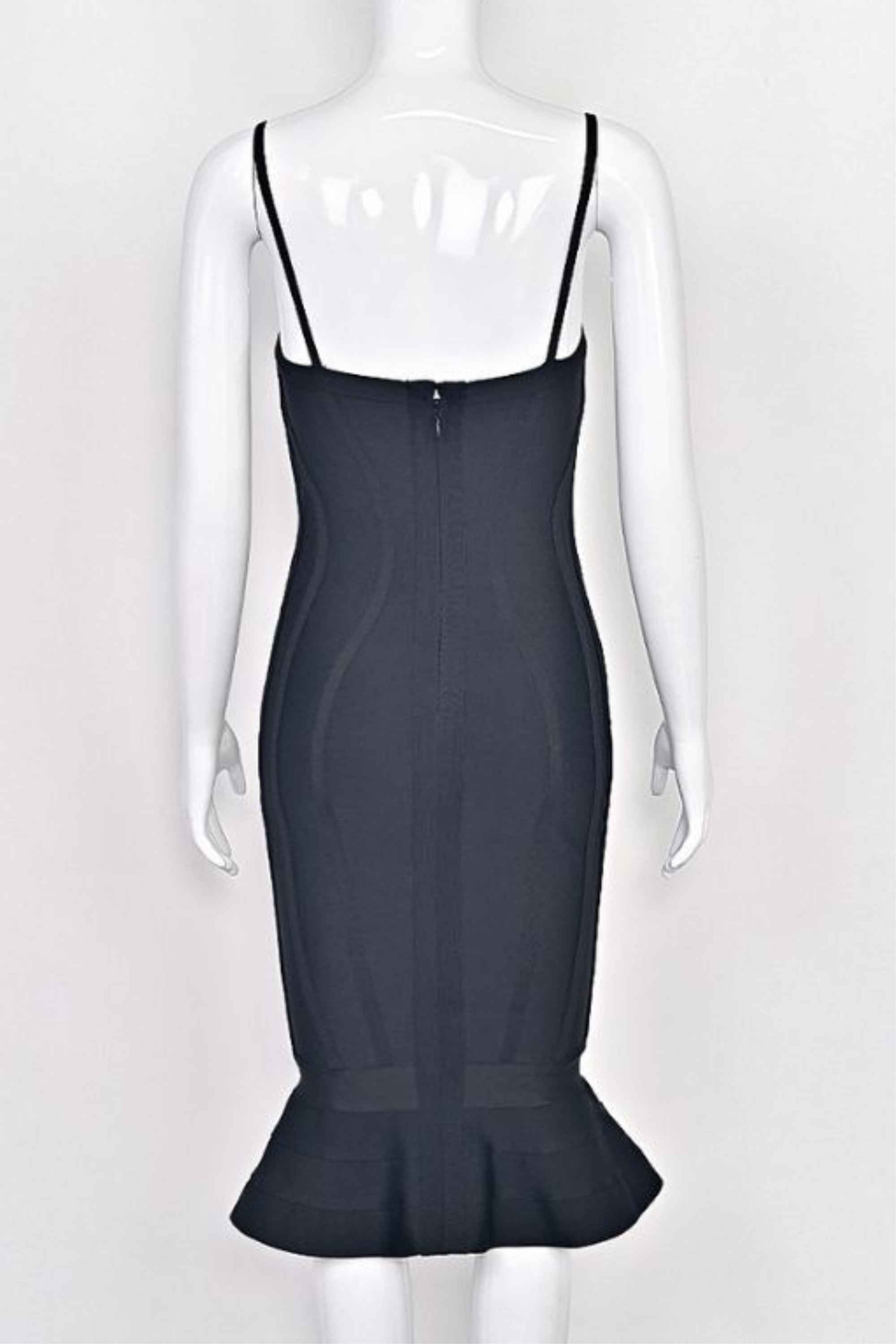 Woman wearing a figure flattering  Joy Bandage Midi Dress - Classic Black Bodycon Collection