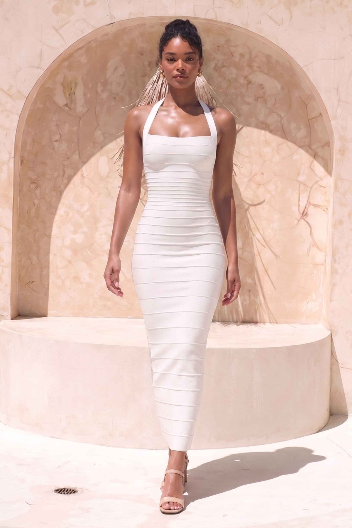 Woman wearing a figure flattering  Kia Bandage Maxi Dress - White Pearl BODYCON COLLECTION Pty Ltd