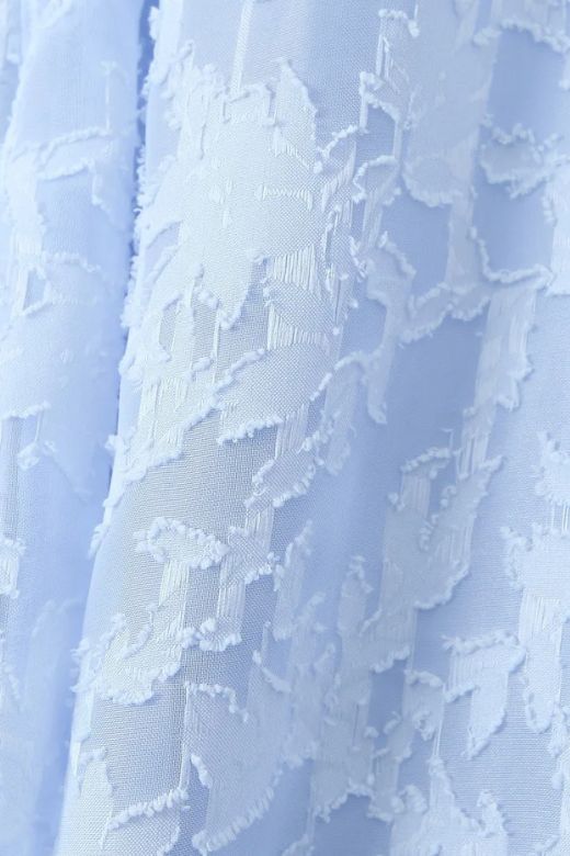 Woman wearing a figure flattering  Kora Bodycon Maxi Dress - Baby Blue BODYCON COLLECTION