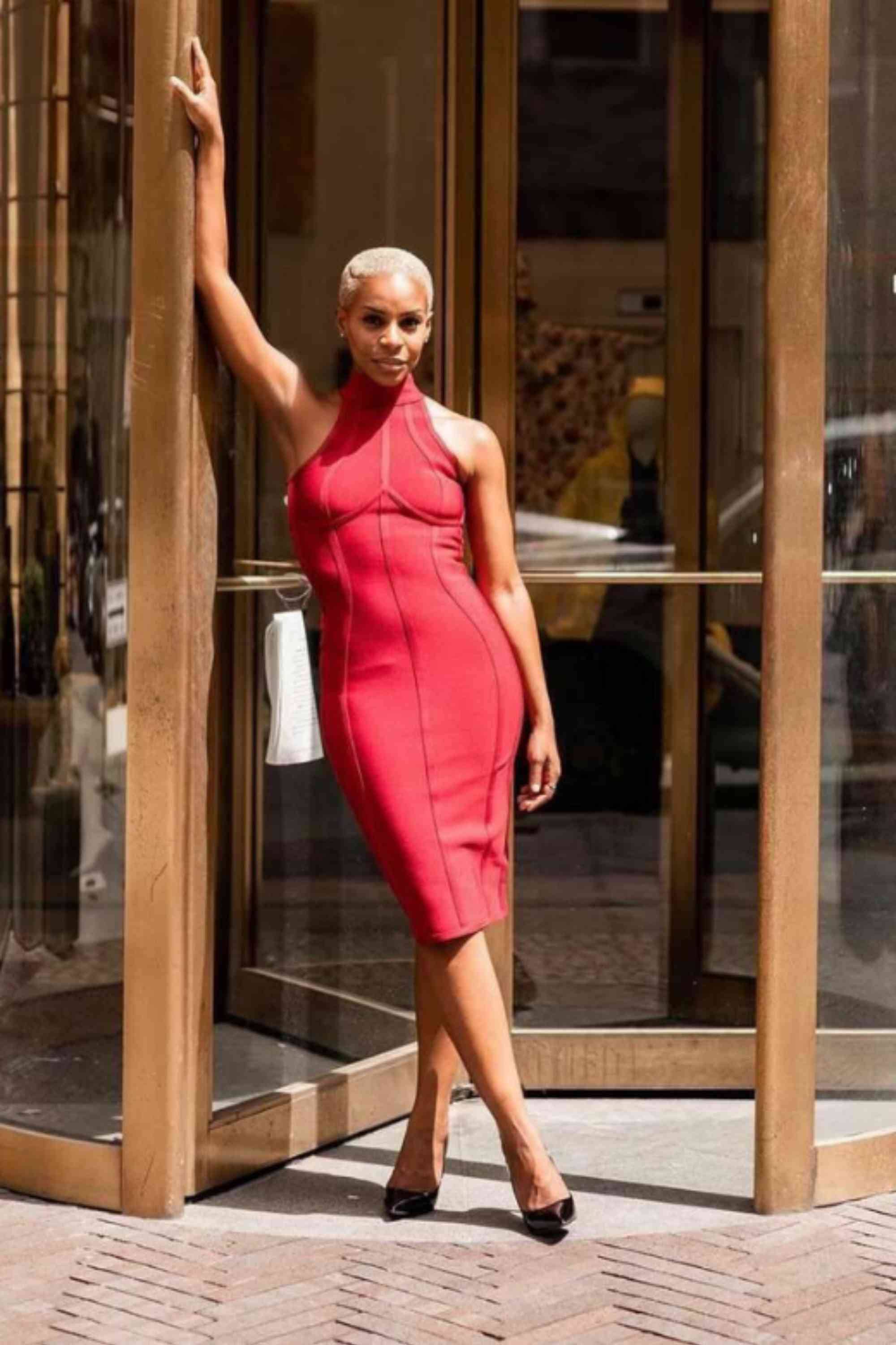 Woman wearing a figure flattering  Lea Bandage Midi Dress - White Pearl Bodycon Collection