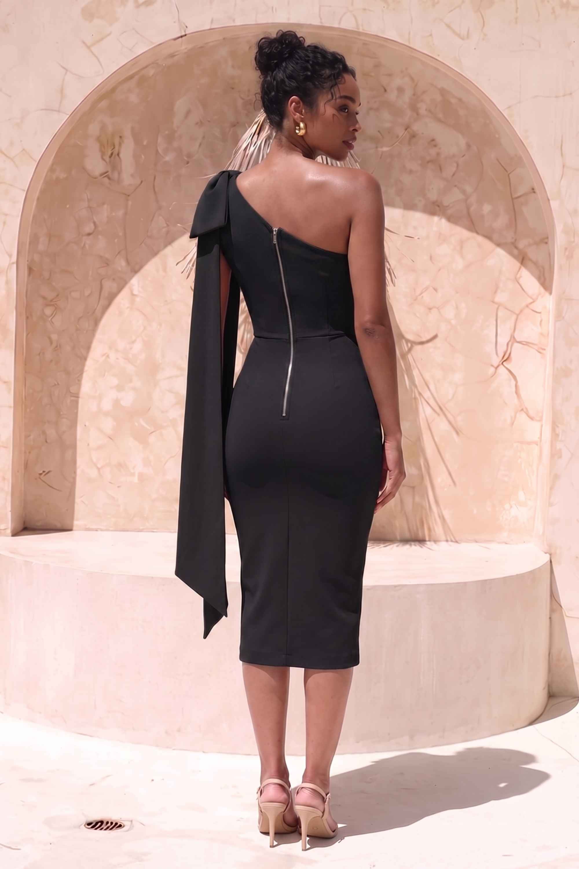Woman wearing a figure flattering  Lela Long Sleeve Bandage Midi Dress - Classic Black BODYCON COLLECTION