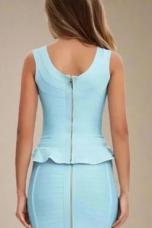 Woman wearing a figure flattering  Leni Bandage Top - Sky Blue BODYCON COLLECTION