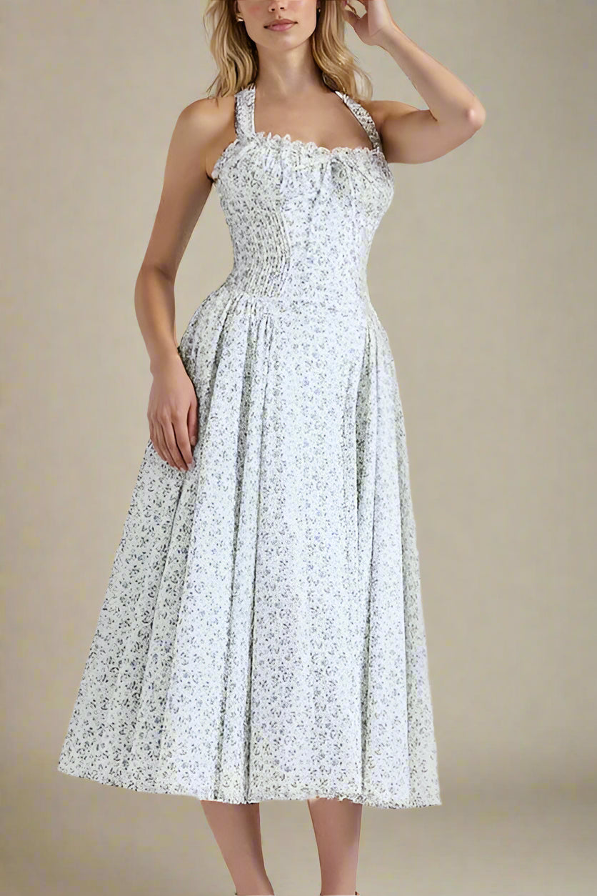 Woman wearing a figure flattering  Lynsie Bodycon Midi Dress - Blue Floral BODYCON COLLECTION