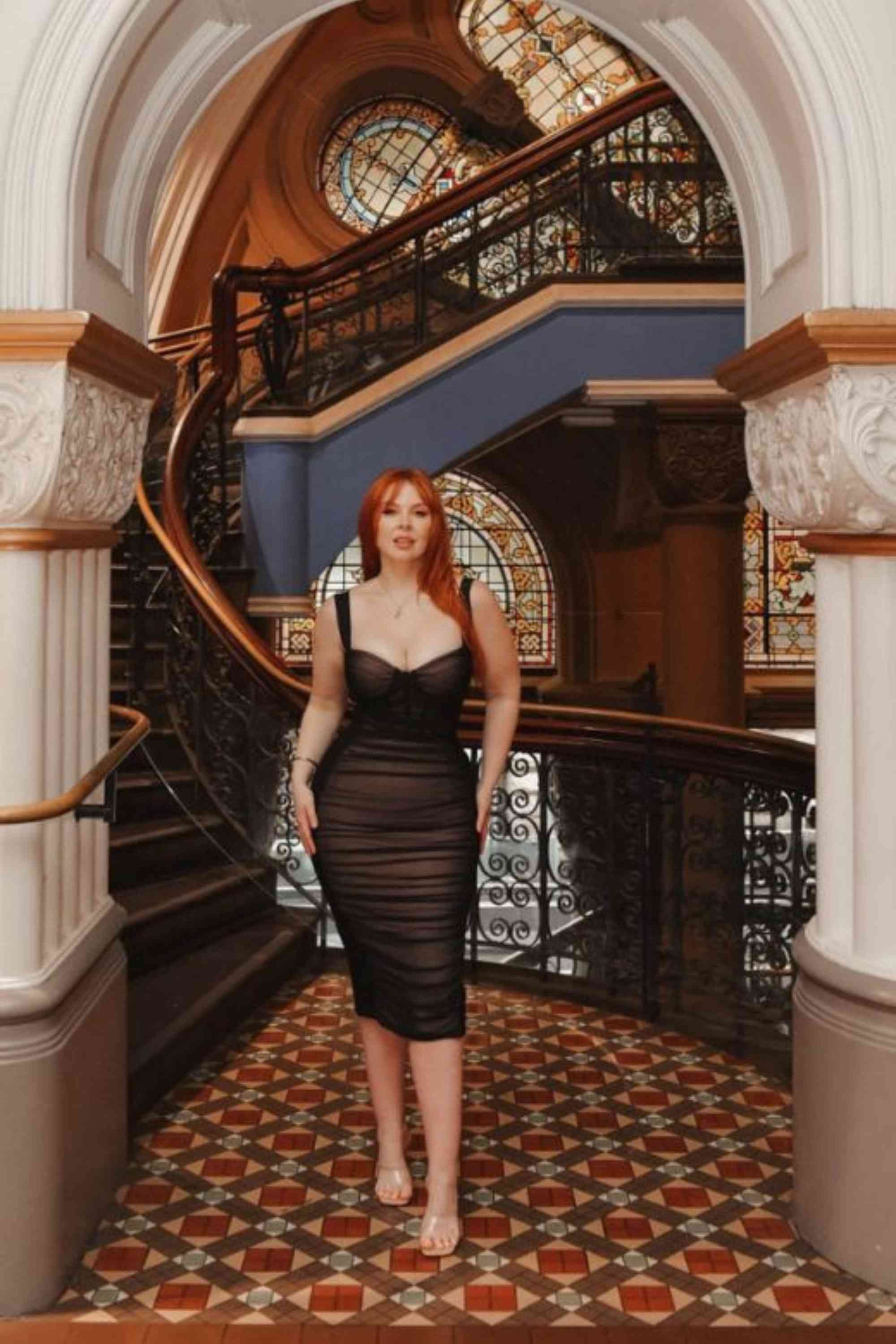 Woman wearing a figure flattering  Marilyn Bodycon Wrap Midi Dress - Classic Black BODYCON COLLECTION