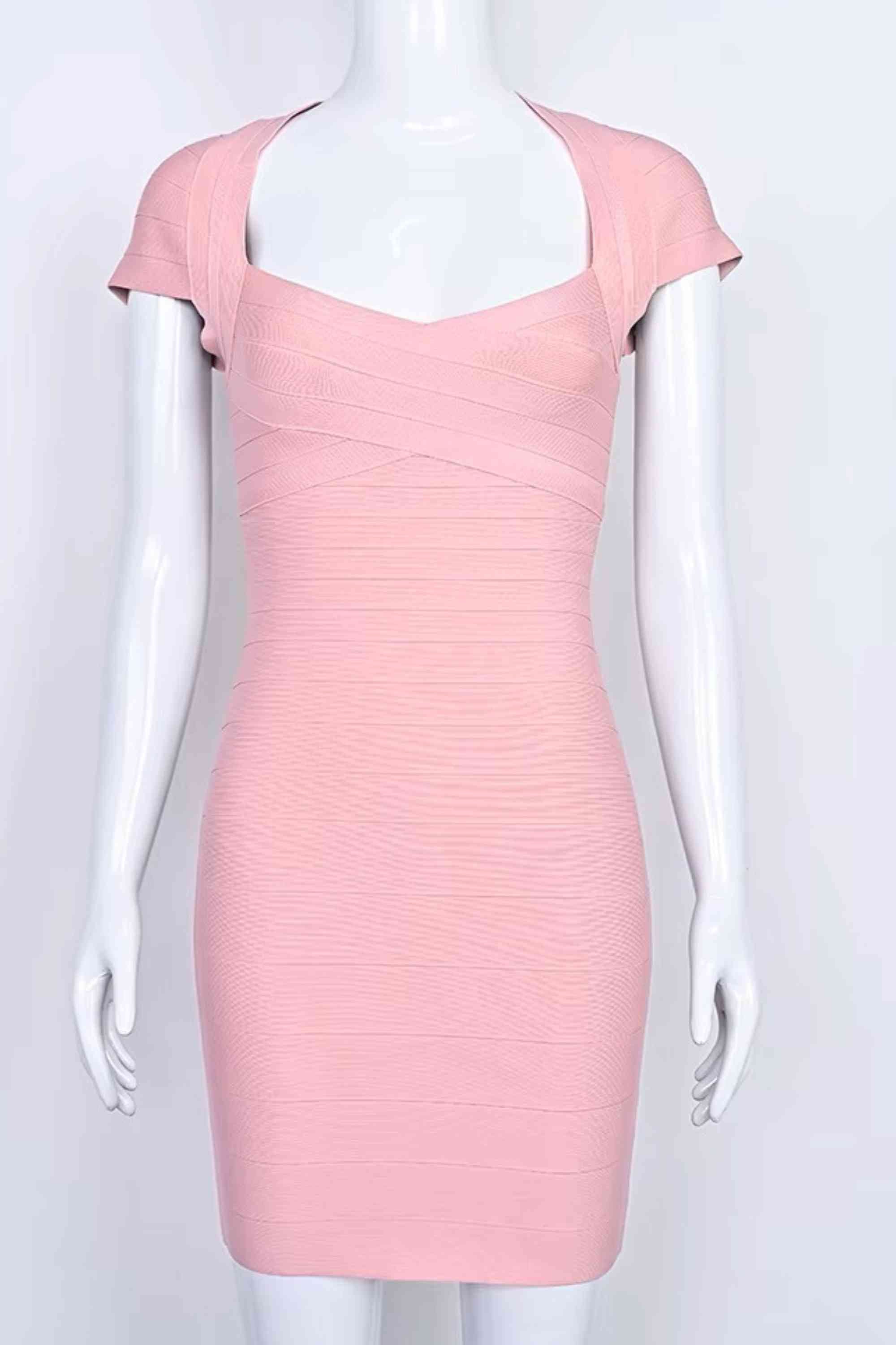 Woman wearing a figure flattering  Miranda Bandage Mini Dress - Ballet Pink Bodycon Collection