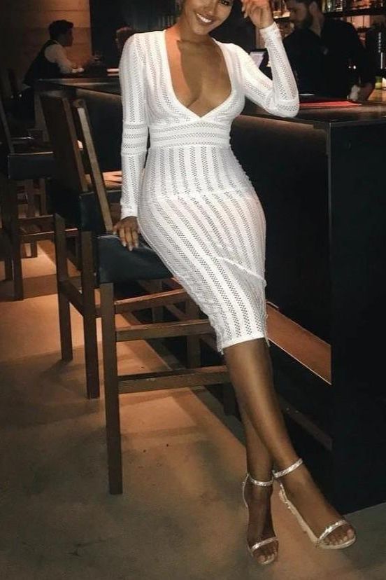 Woman wearing a figure flattering  Olivia Long Sleeve Bandage Midi Dress - Pearl White Bodycon Collection