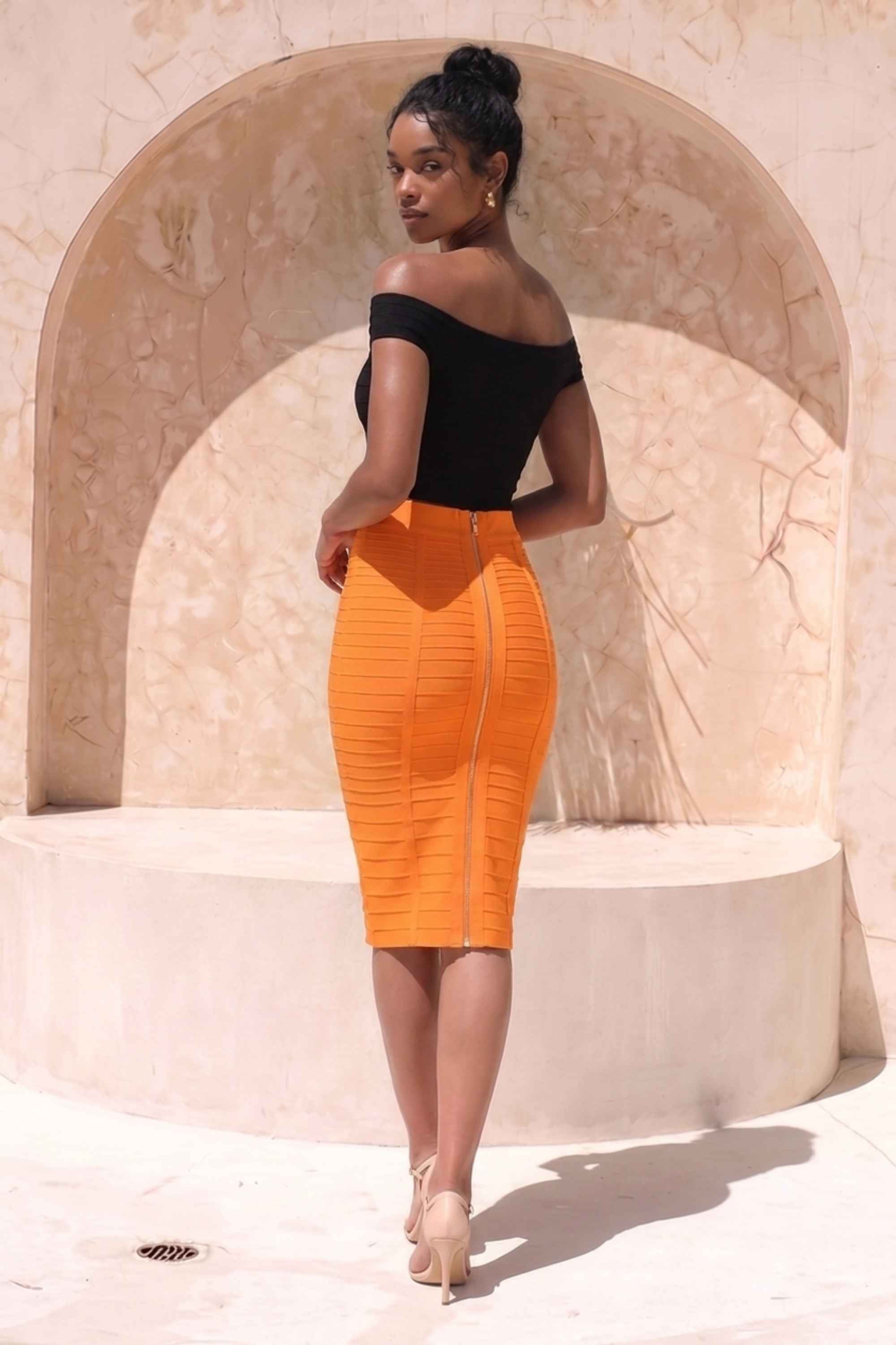 Woman wearing a figure flattering  Pencil High Waist Bandage Knee Length Knitted Skirt - Apricot Orange BODYCON COLLECTION